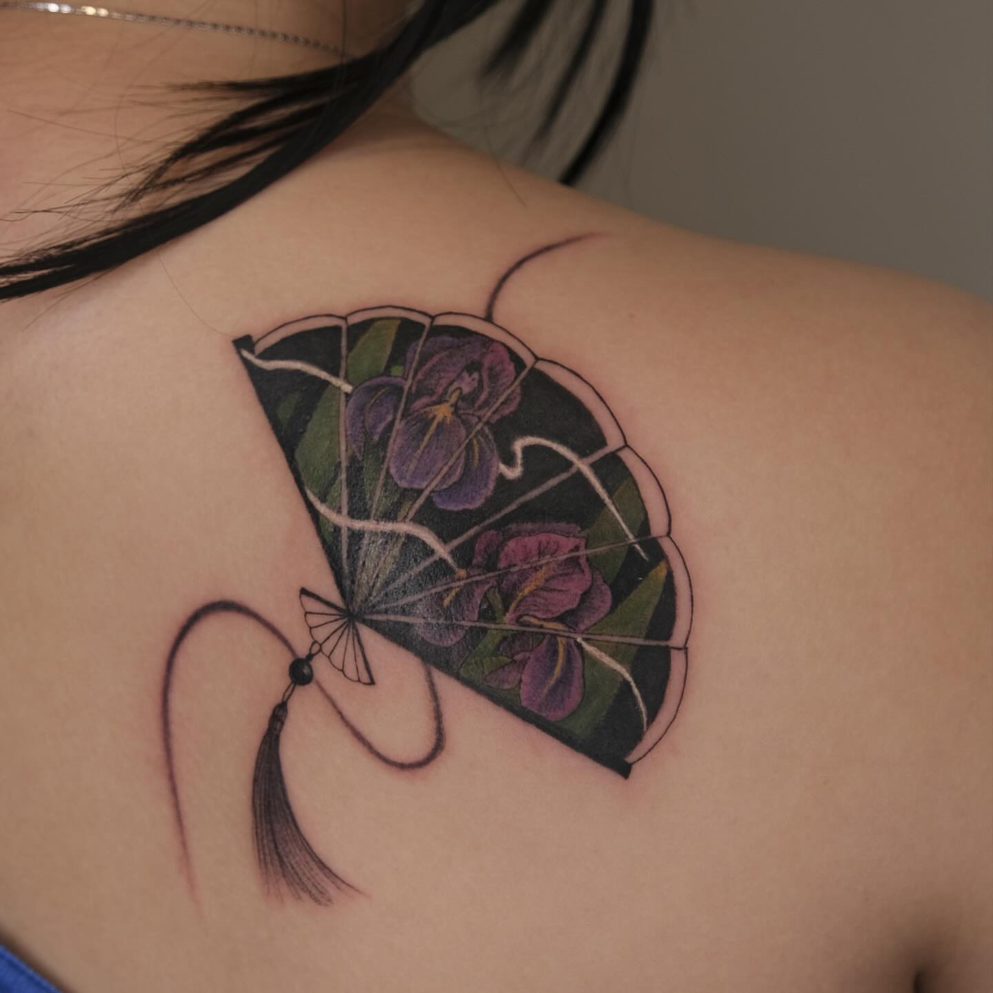 Fan with flowers dotwork tattoo on the shoulder by Ka hiu chiu