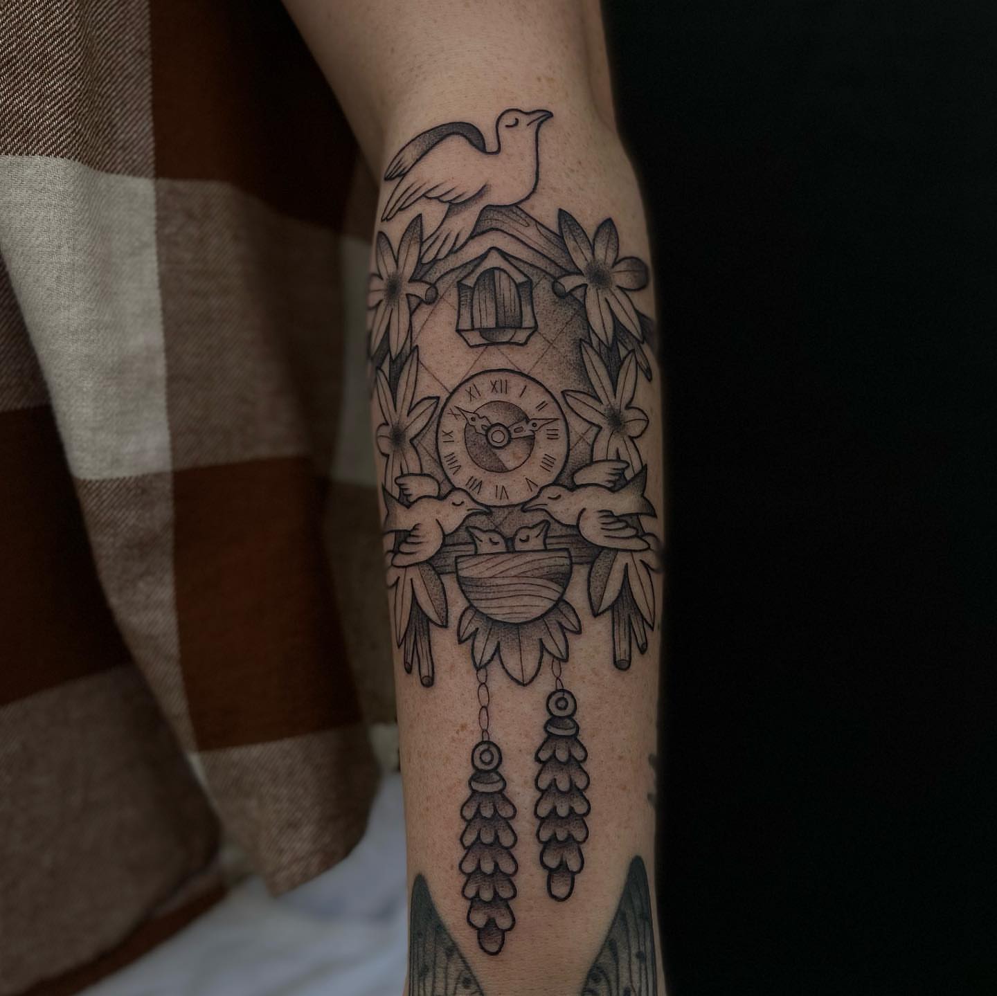 Birdhouse and birds black and grey tattoo on the forearm by Luna