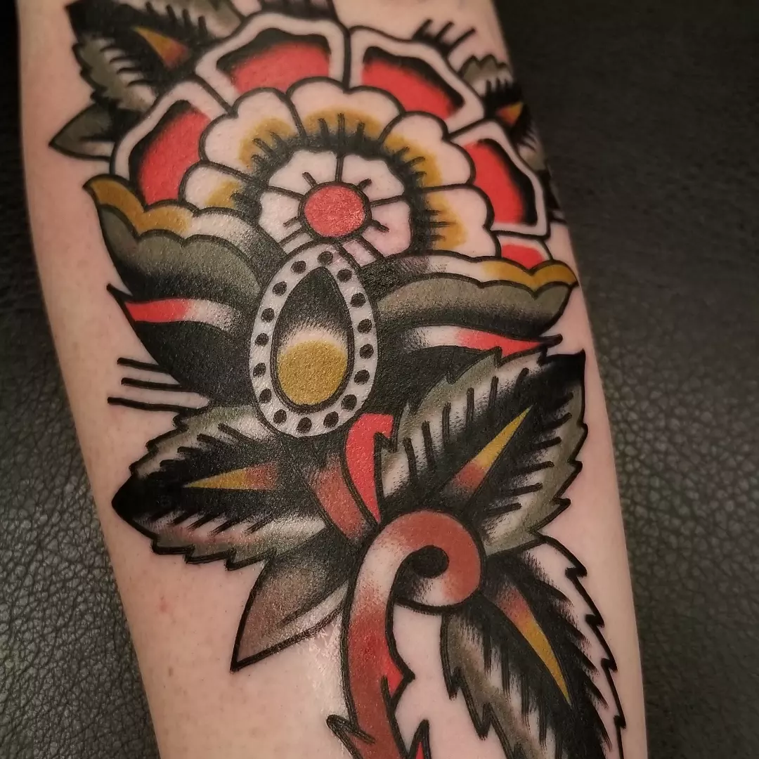 Flower American traditional tattoo on the forearm by Deke Harms, Bend, Oregon