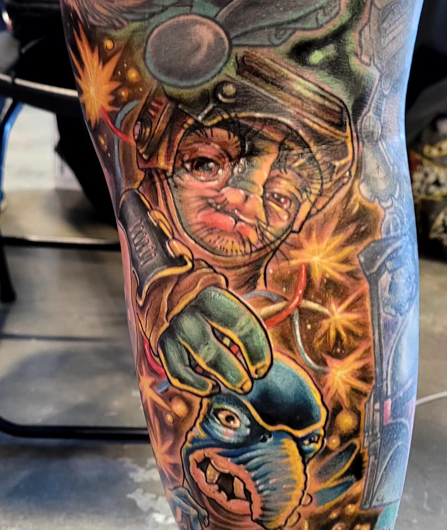 Astronaut and alien realism tattoo on the forearm by Dawne Michele