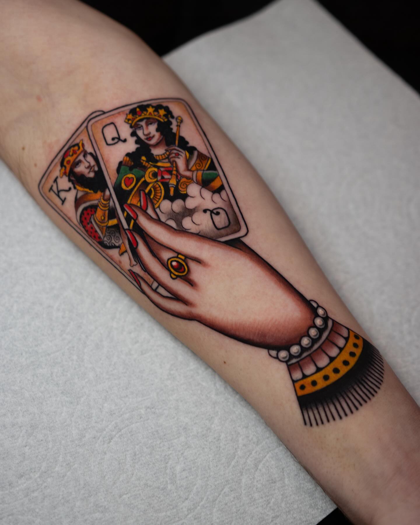 Playing card characters American traditional tattoo on the forearm by Danny Derrick, San Luis Obispo, California