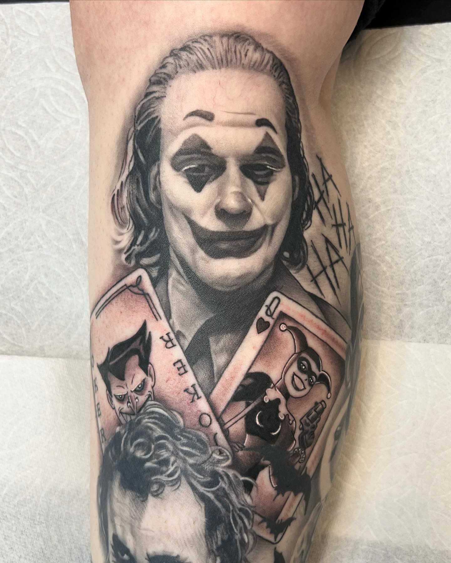 Joker character realism tattoo on the forearm by Nick Bridwell, Downey, California