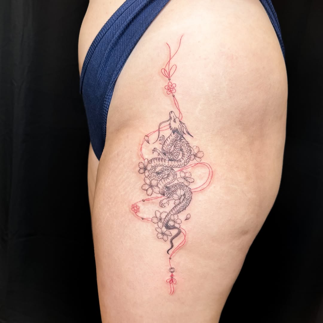 Dragon and cherry blossoms ornamental tattoo on the shoulder by INK by CEE