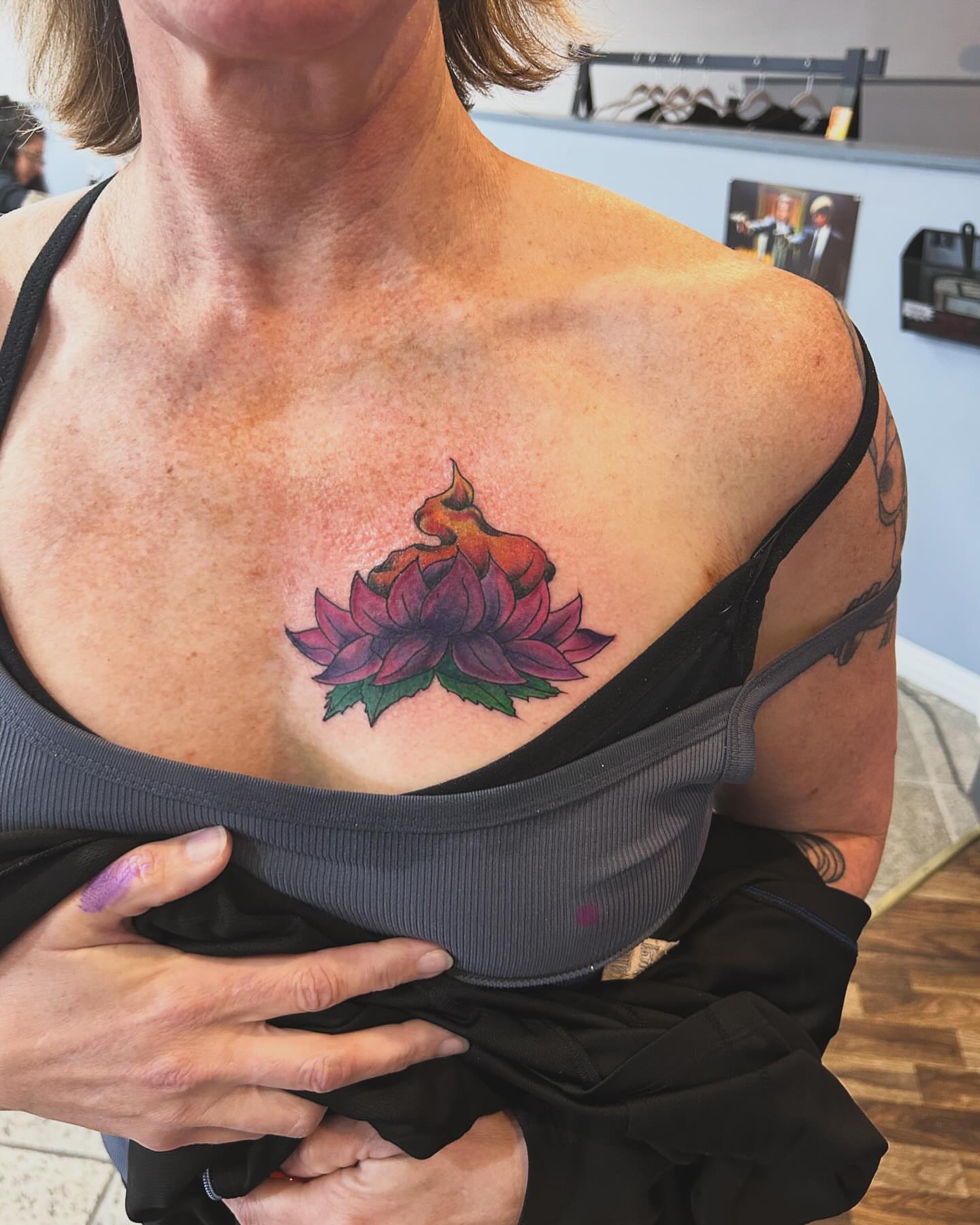 Lotus flower dotwork tattoo on the chest by Joey-tattoo Artist
