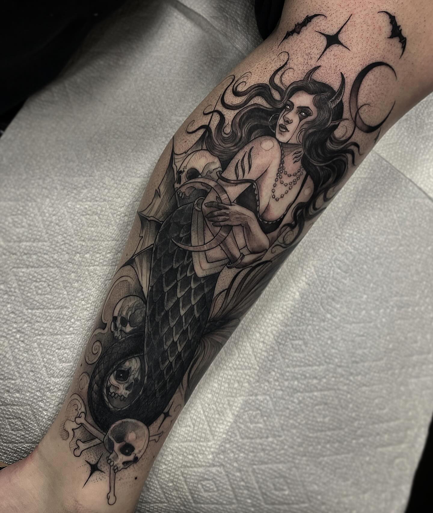 Mermaid and skulls dotwork tattoo on the forearm by Marissa Tattoos
