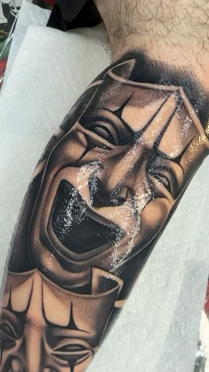 Comedy and tragedy masks realism tattoo by Joseph Alvarado