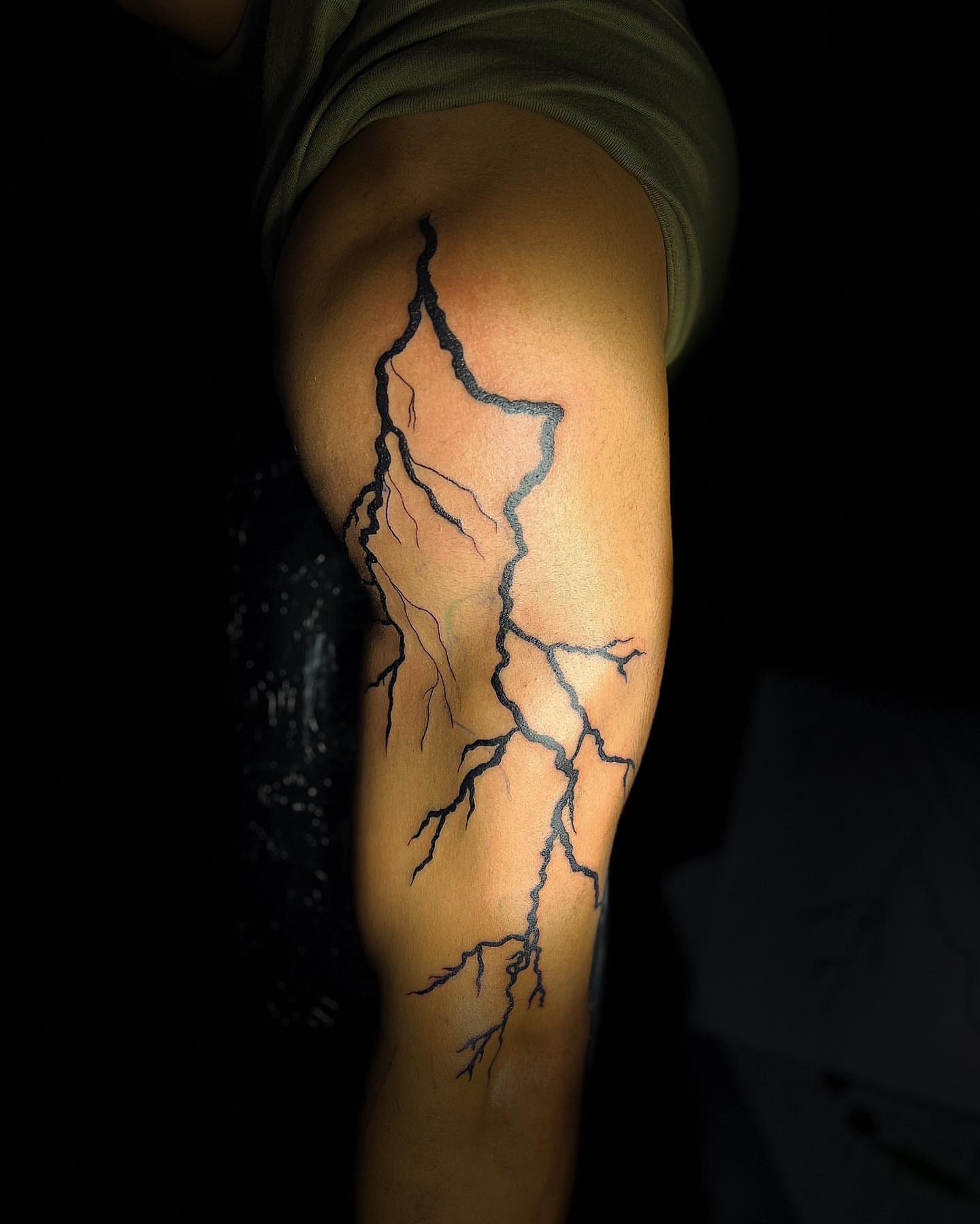 Lightning bolt black and grey tattoo on the forearm by @tattsbyleek