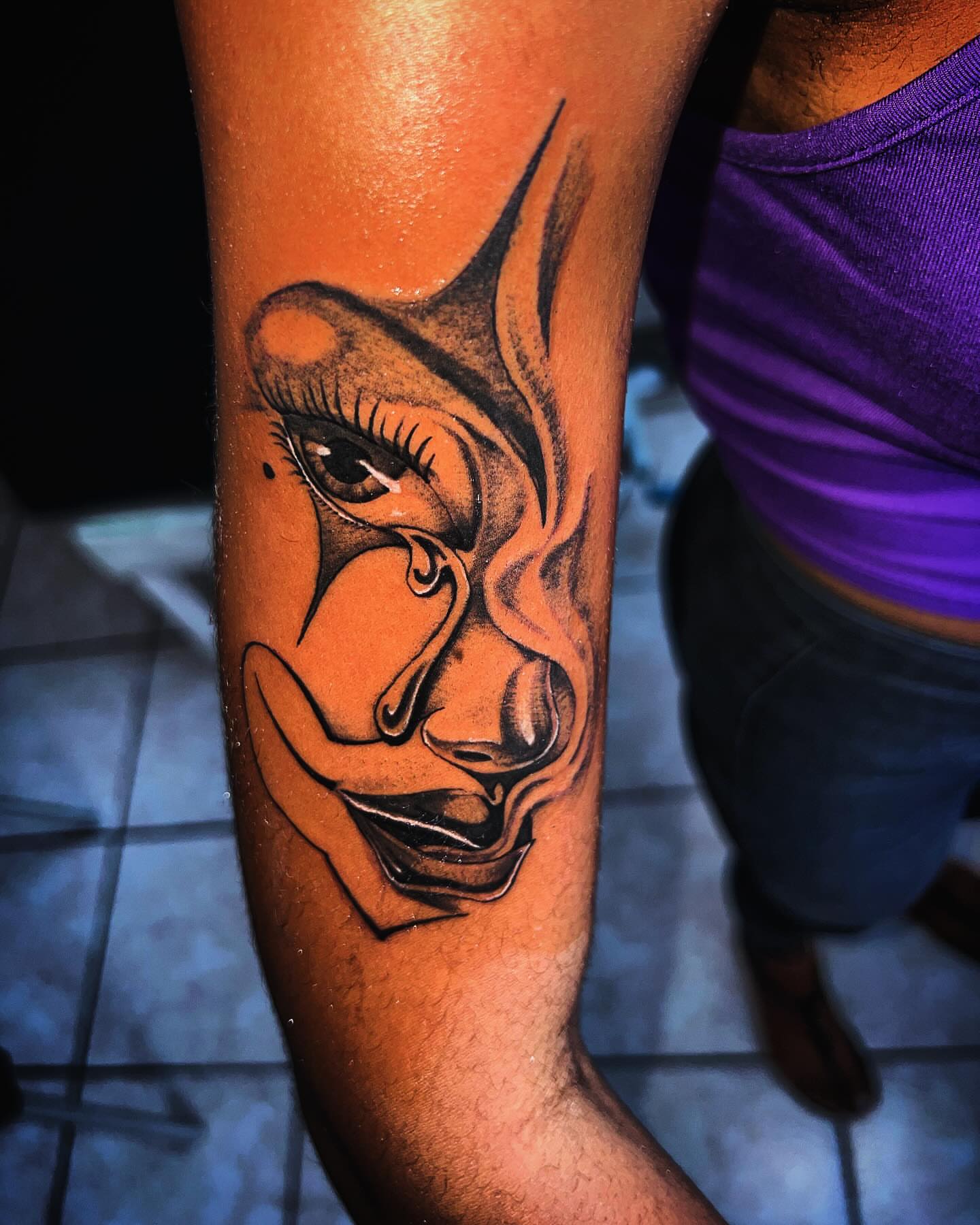 Abstract face black and grey tattoo on the forearm by oxideTattoo, Morne-à-l'Eau