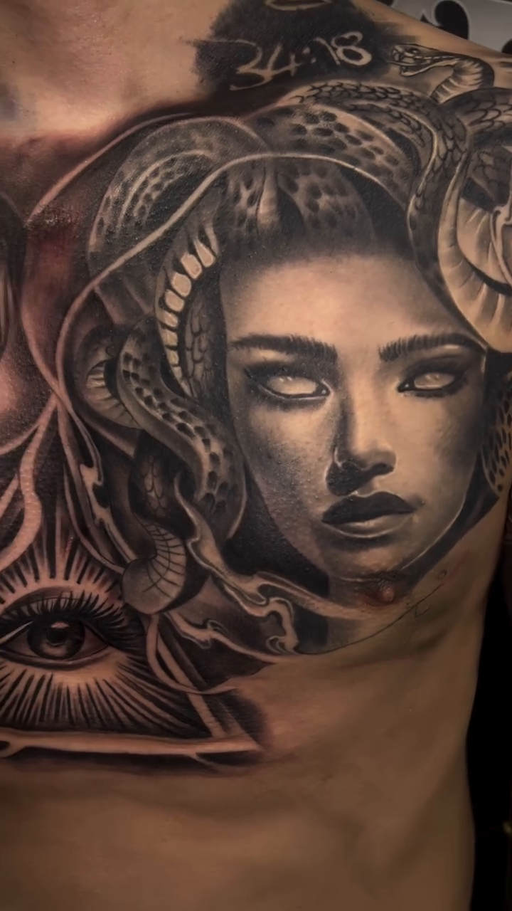 Medusa and a bearded man realism tattoo by Tattoo