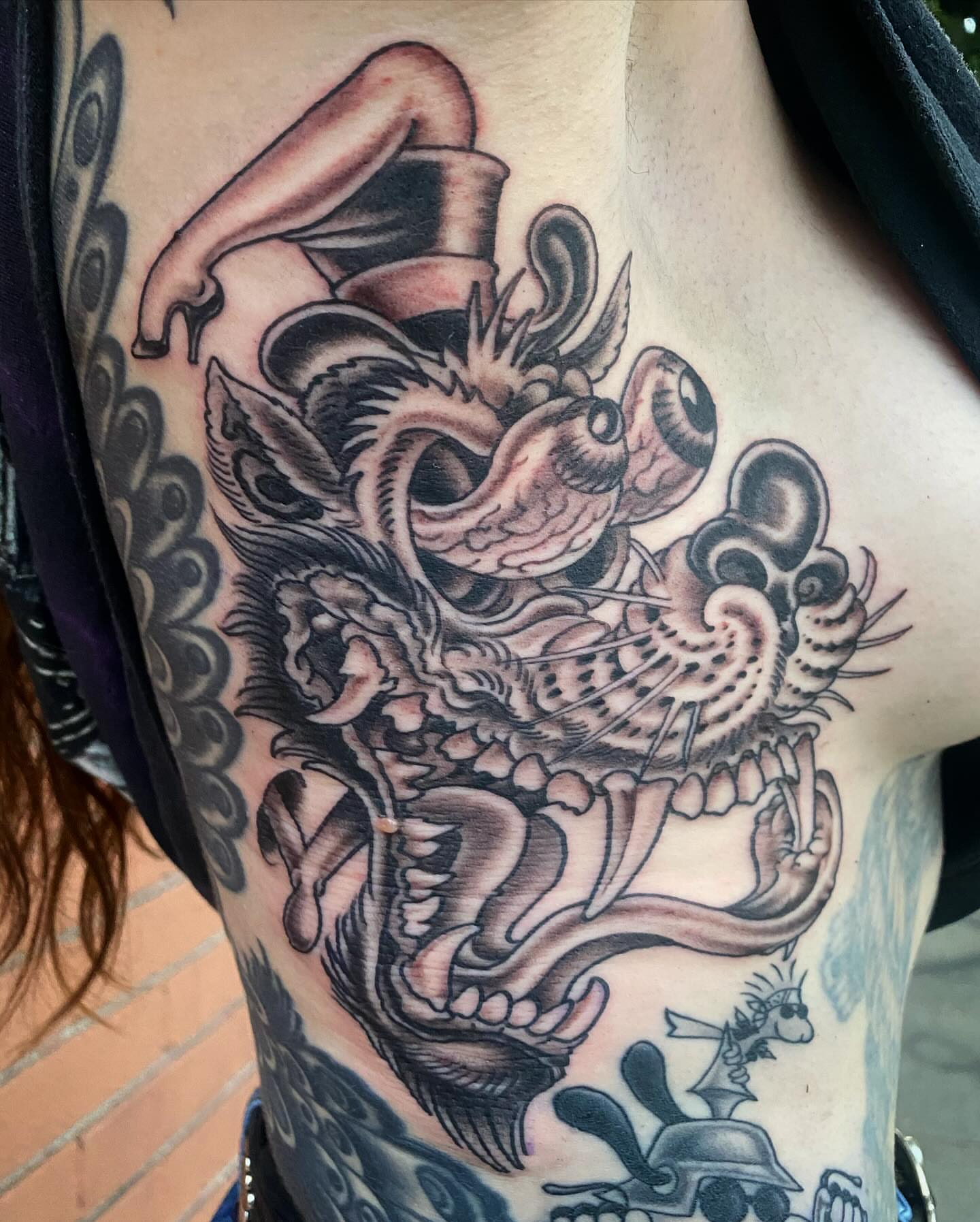 Dragon American traditional tattoo on the shoulder by Adam Warmerdam, Los Angeles, California
