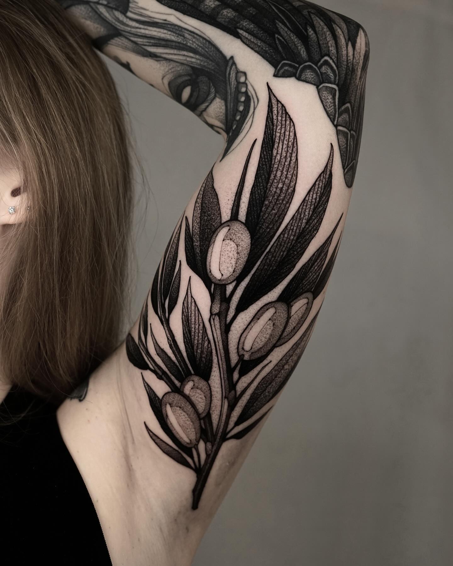 Olive branch dotwork tattoo on the forearm by Max LaCroix