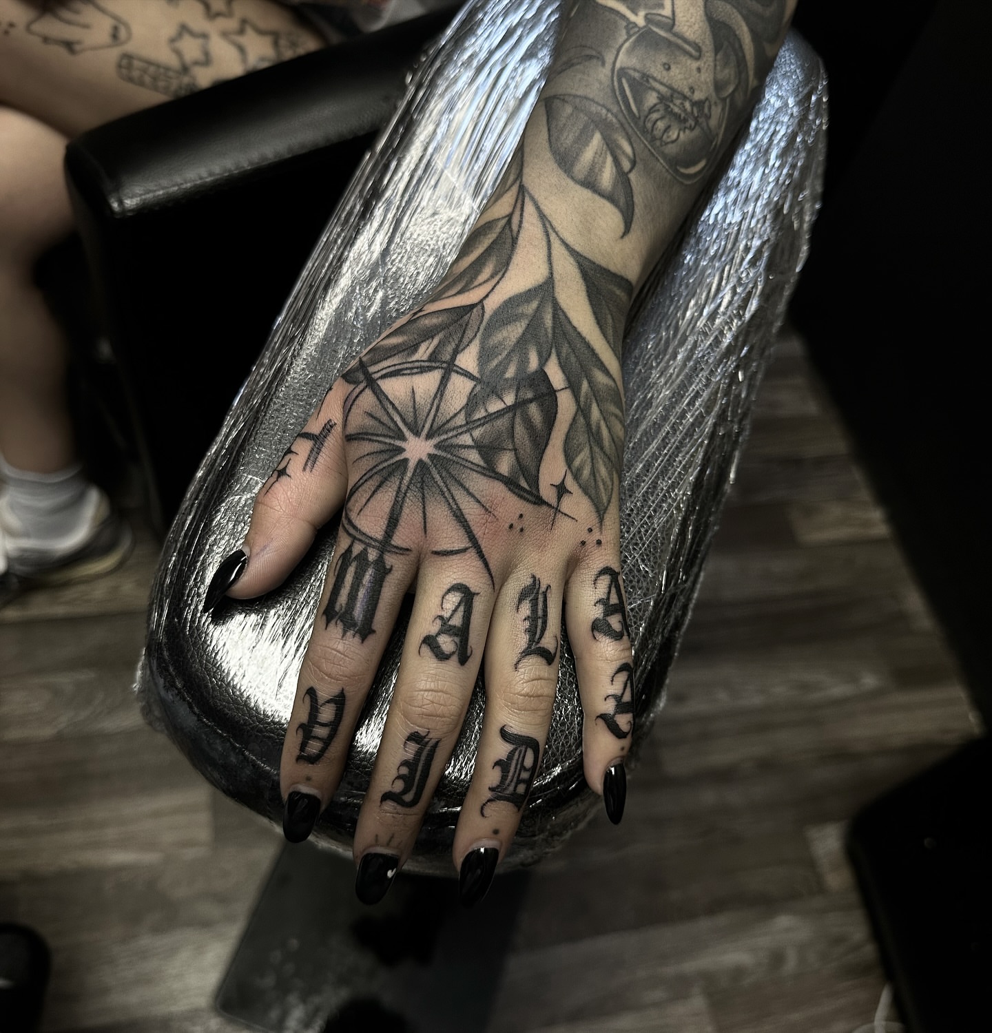 Compass and leaves geometric tattoo on the hand by Tattoosxjoseph