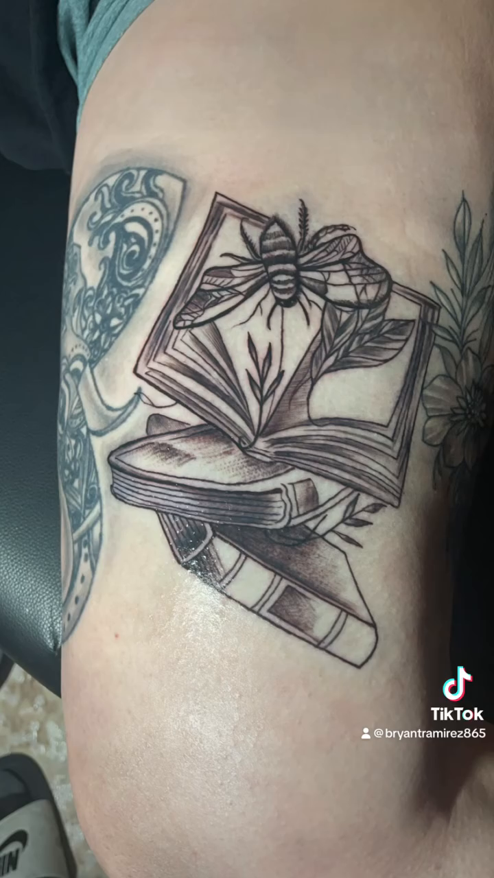 Open book and spider realism tattoo by Bryant Ramirez