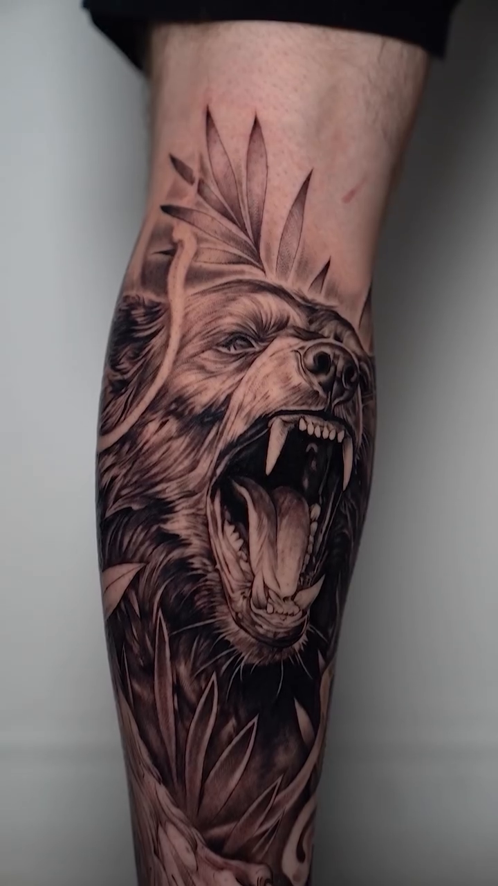 Bear head with foliage realism tattoo by Ethan Hubbard
