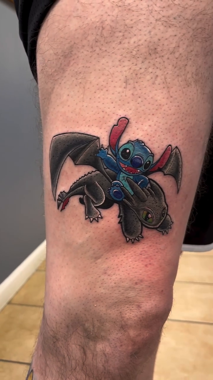 Stitch riding Toothless anime tattoo by Adam Silfies