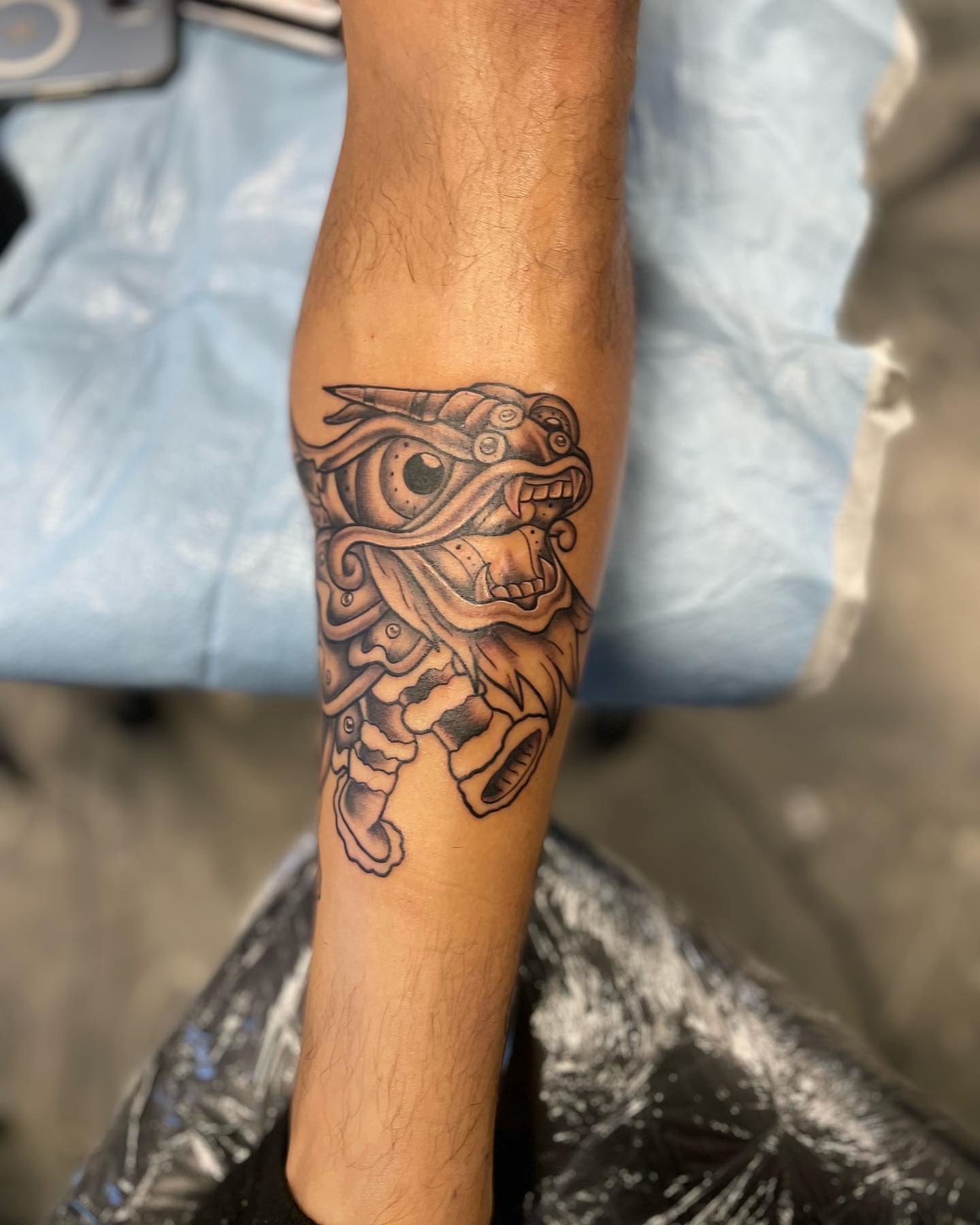 Mech dragon geometric tattoo on the forearm by Brandon Anderson