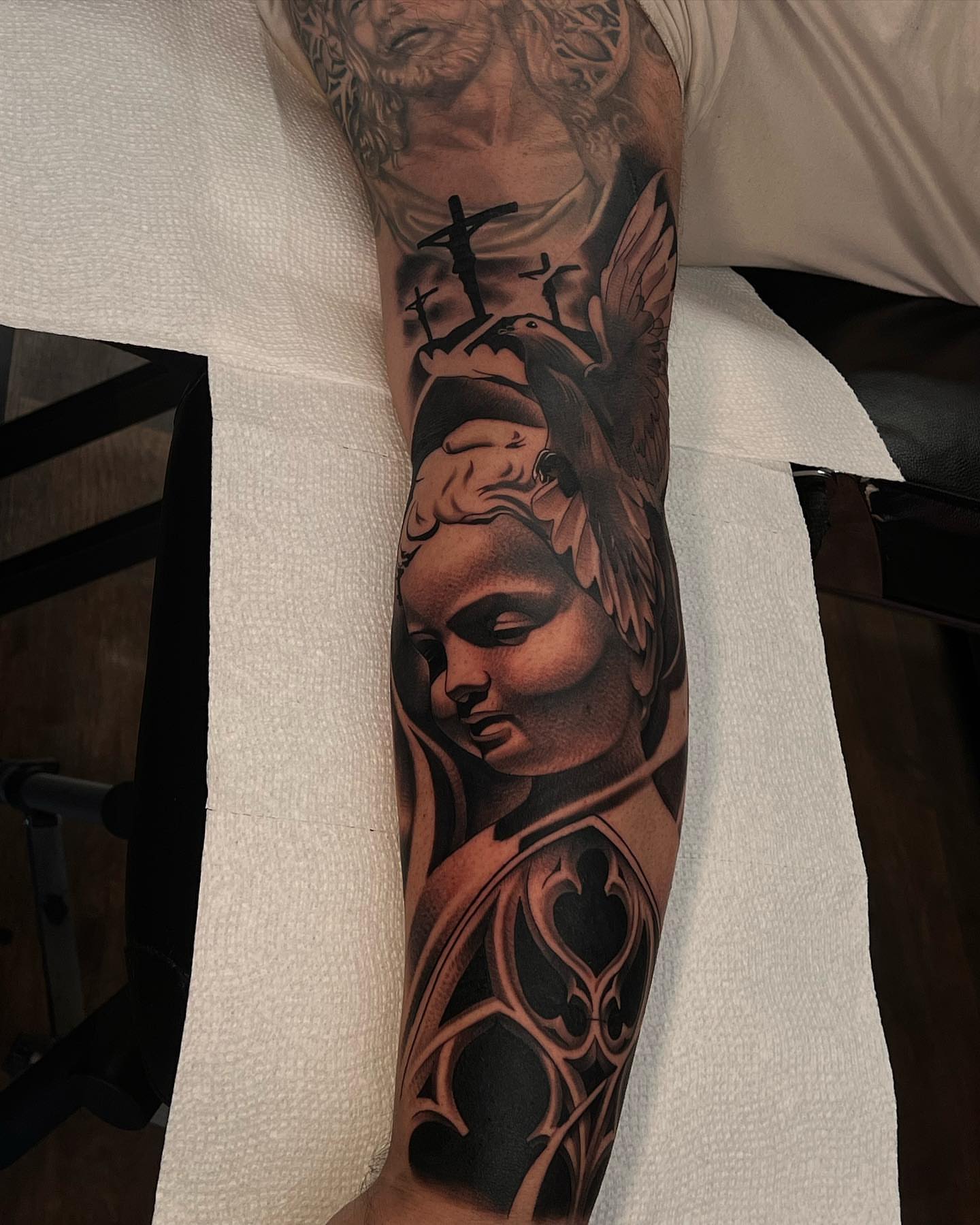 Religious angel realism tattoo on the forearm by 𝖃𝖆𝖛𝖎𝖊𝖗 𝕬. 𝕾𝖆𝖑𝖎𝖓𝖆𝖘