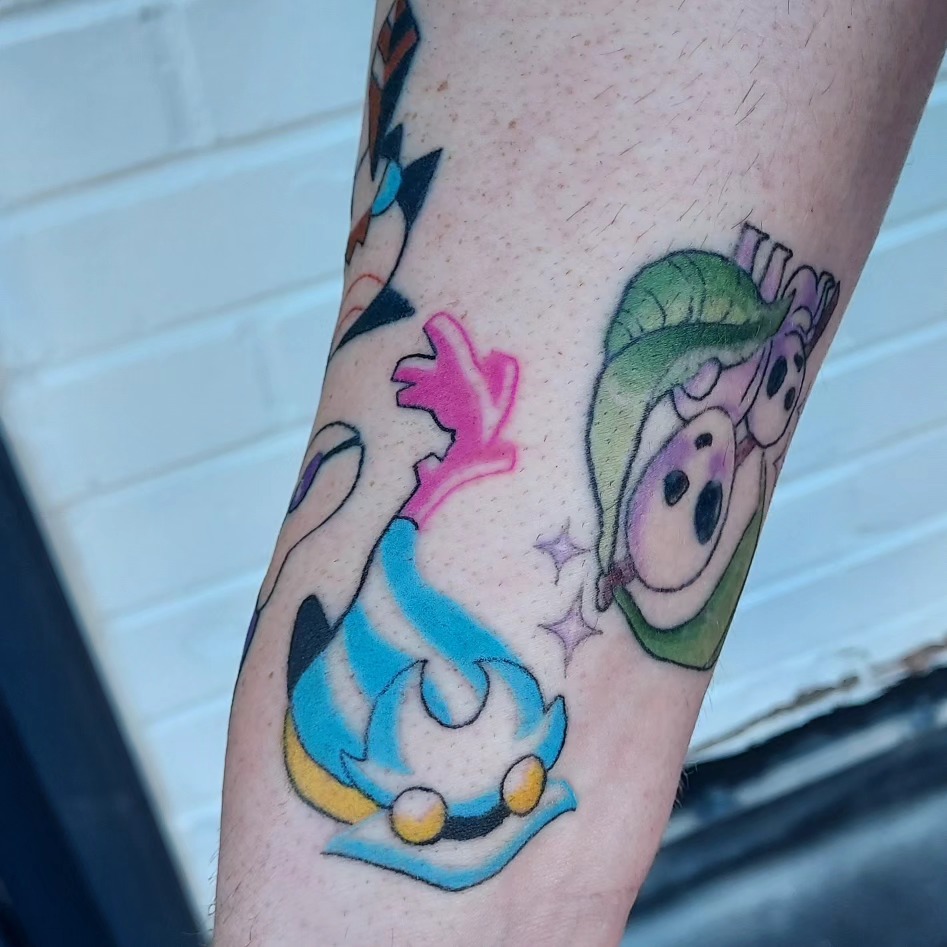 Anime characters new school tattoo on the forearm by Spike Cameron