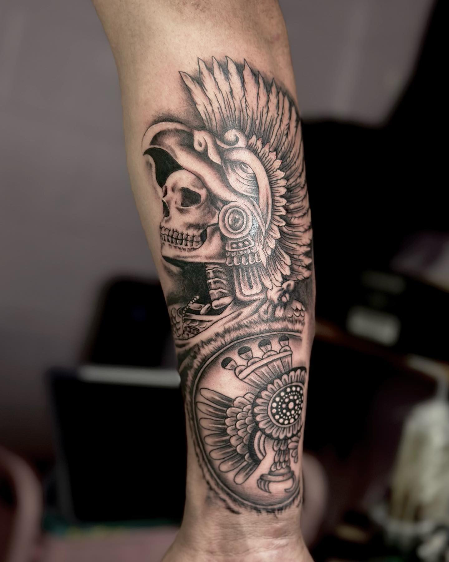 Mexican warrior skull realism tattoo on the forearm by Erika Nambo