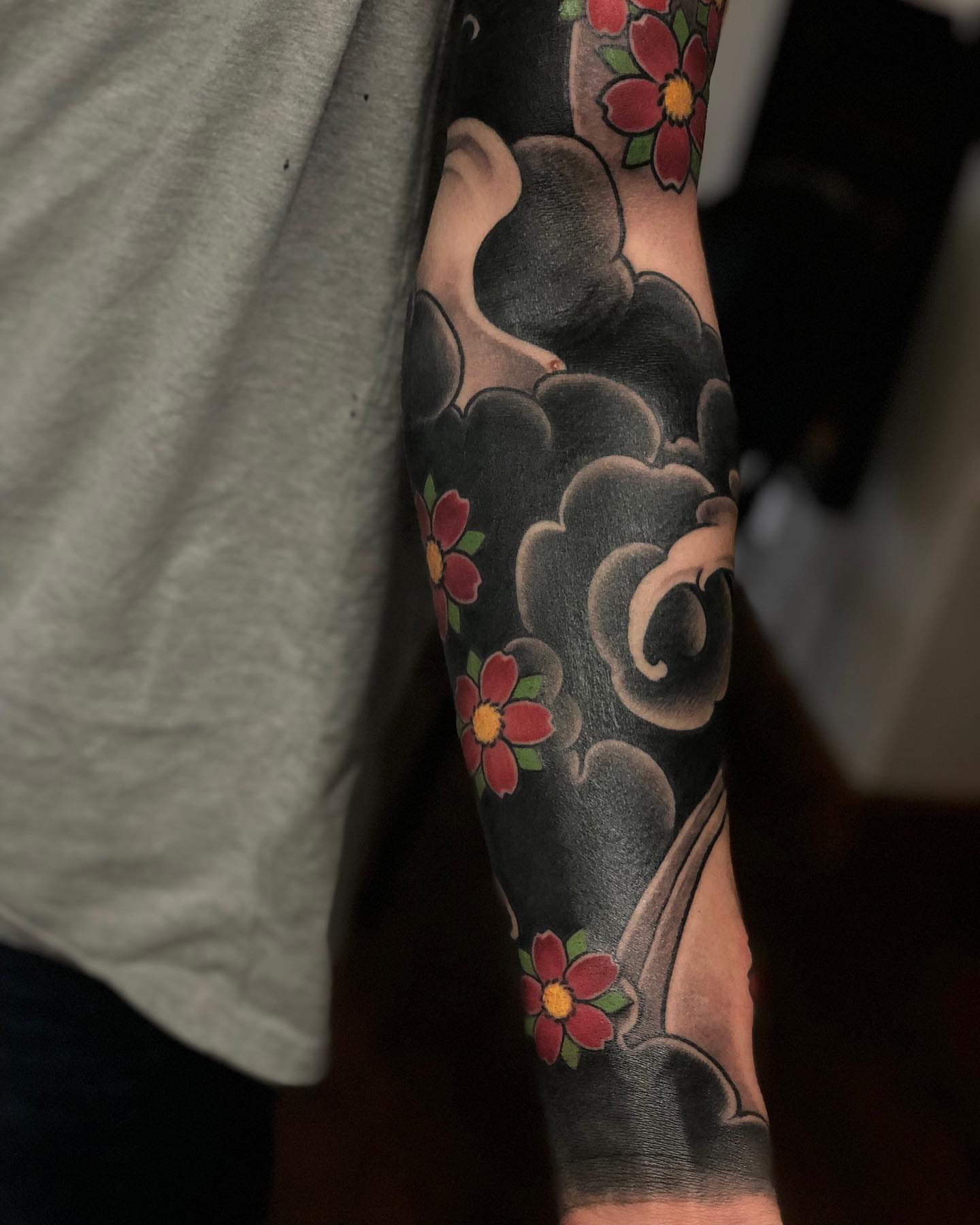 Clouds and flowers japanese irezumi tattoo on the forearm by Aaron Borden