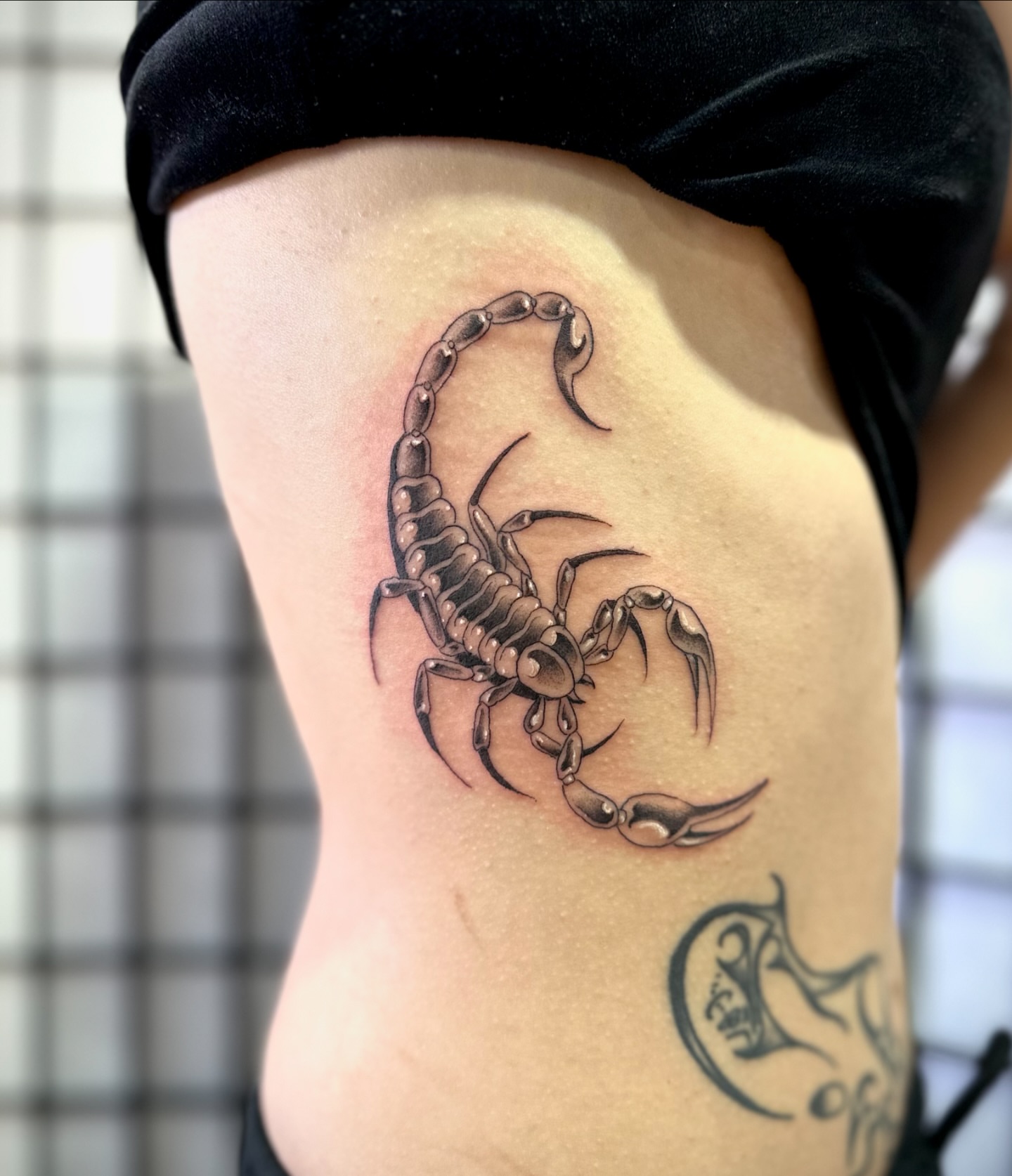 Scorpion black and grey tattoo on the thigh by christian martinez