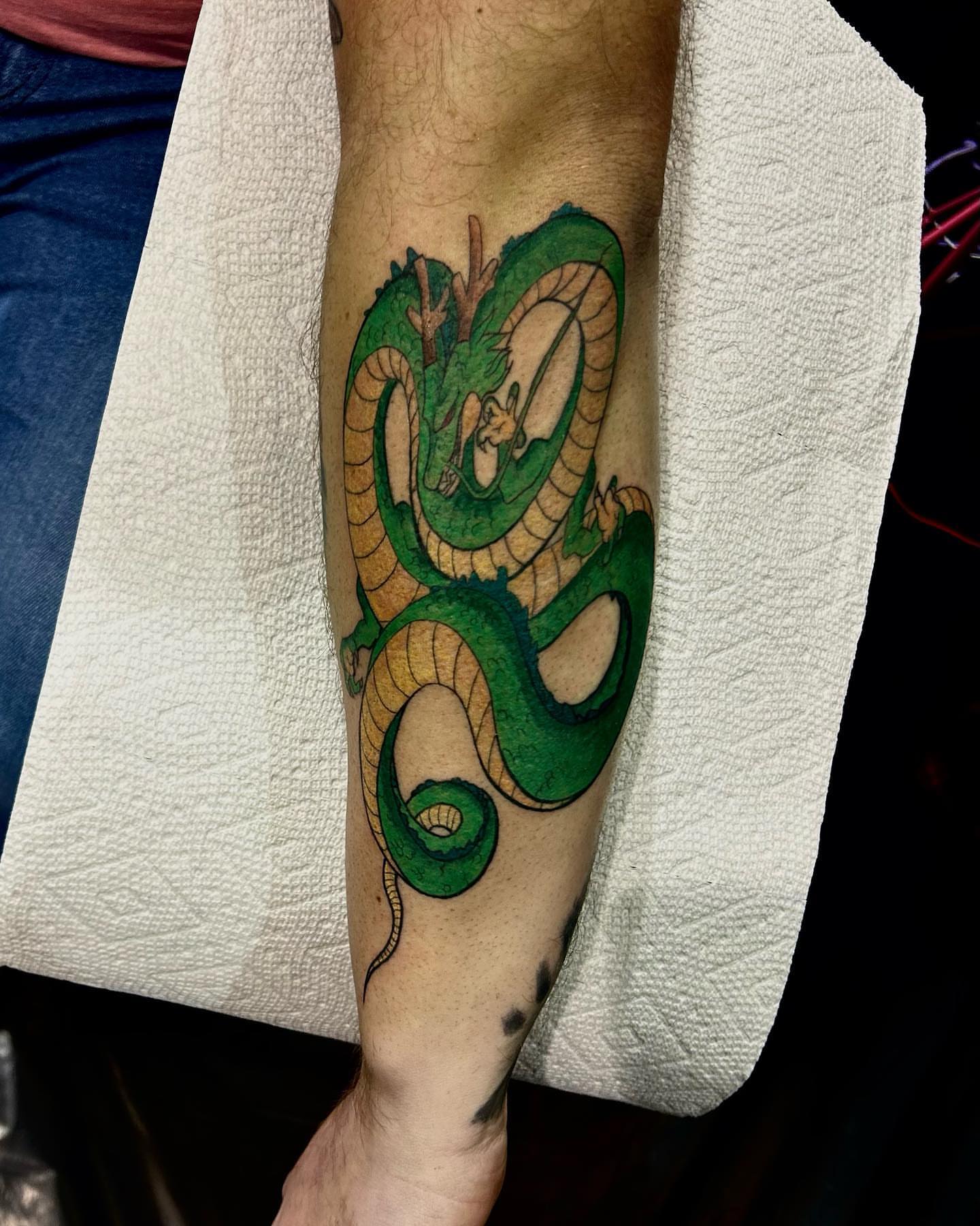 Serpent watercolor tattoo on the forearm by LilDebbie Tatts