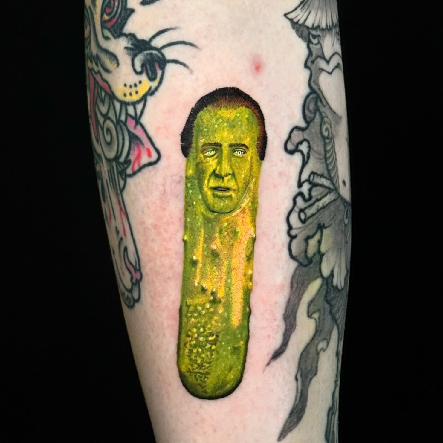 Pickle with face dotwork tattoo on the forearm by Lord Daniel Serna