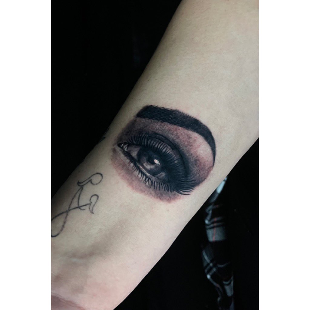 Eye realism tattoo on the forearm by Jelly