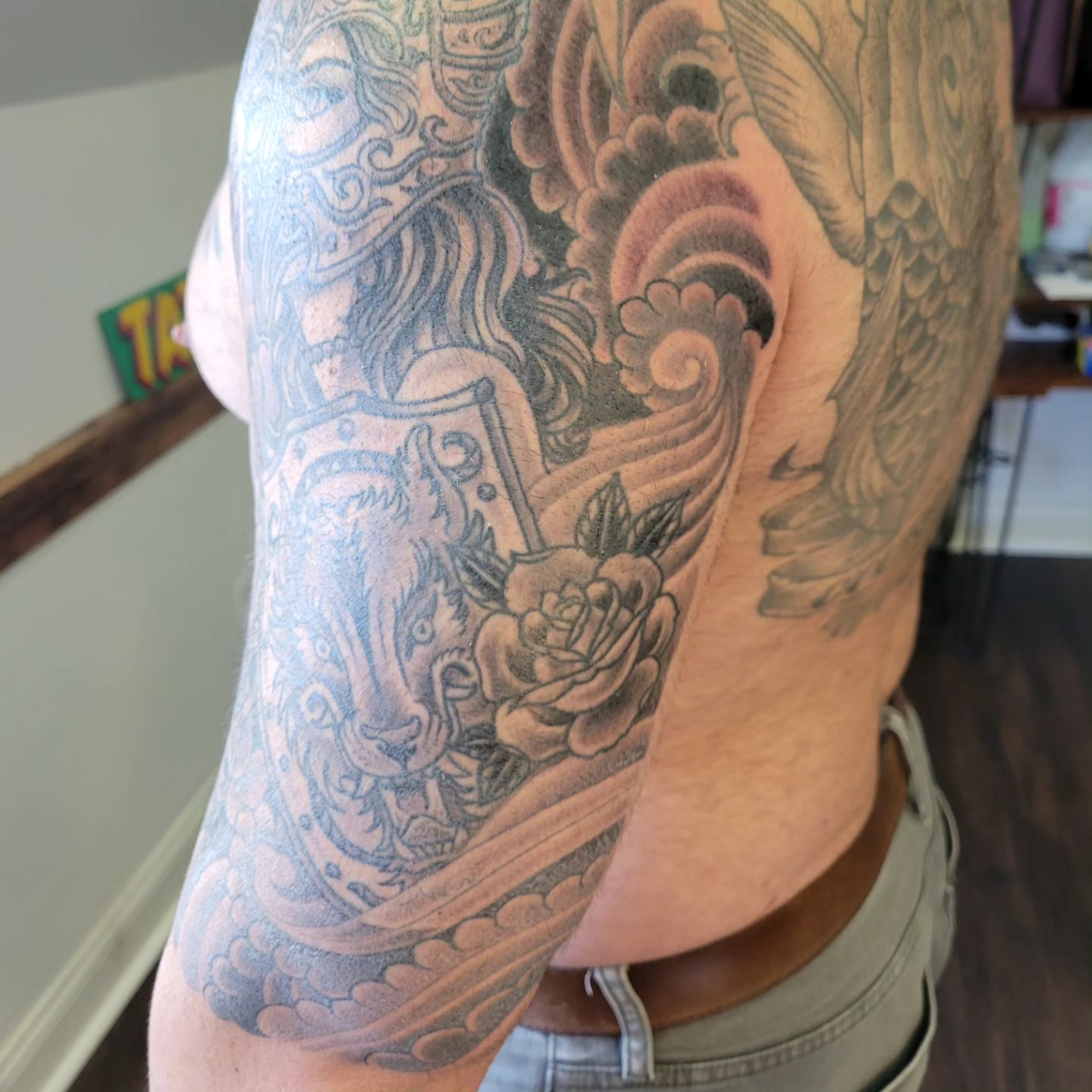 Sword and rose black and grey tattoo on the upper arm by Mark Harada, Hoboken, New Jersey