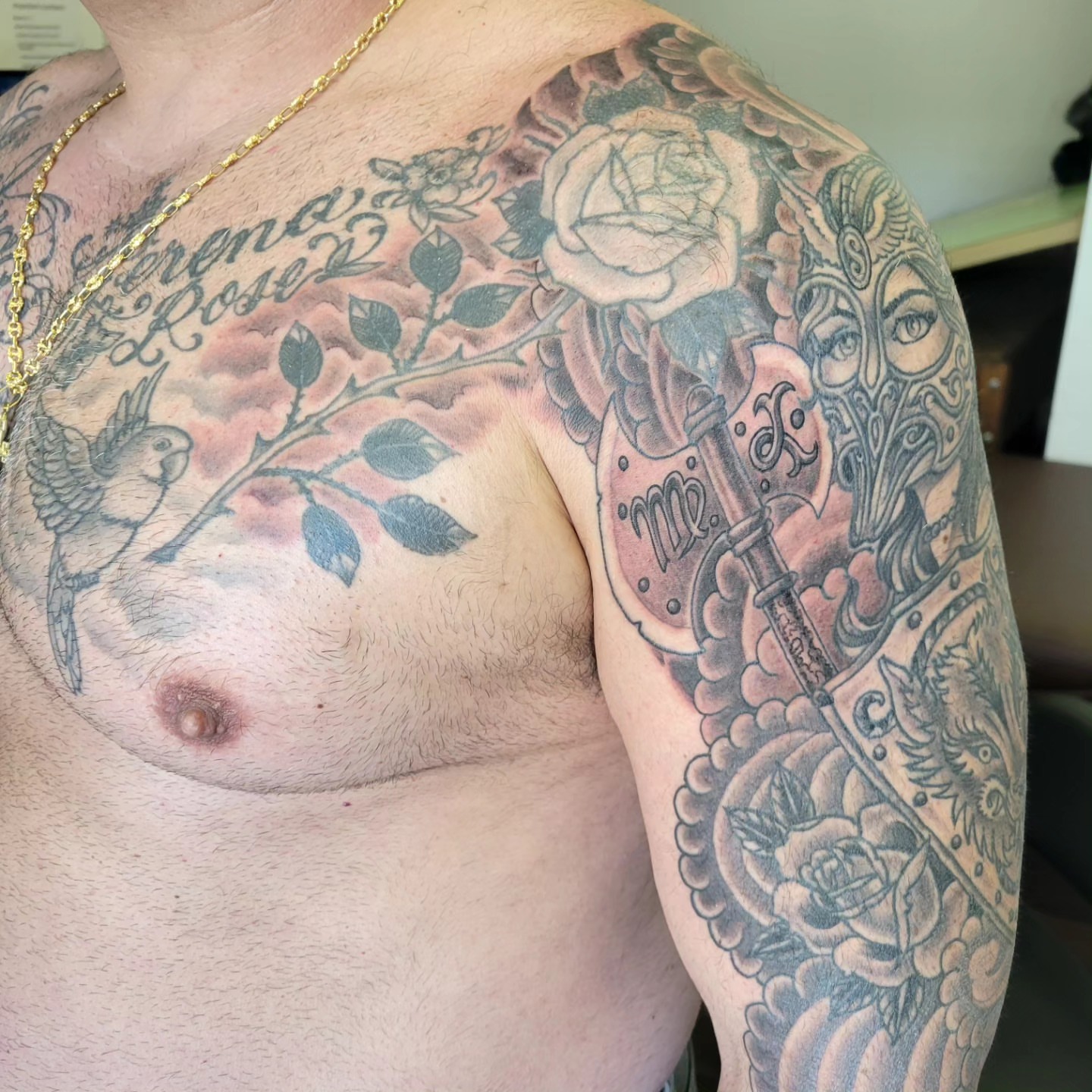 Floral and bird American traditional tattoo on the chest by Mark Harada, Hoboken, New Jersey