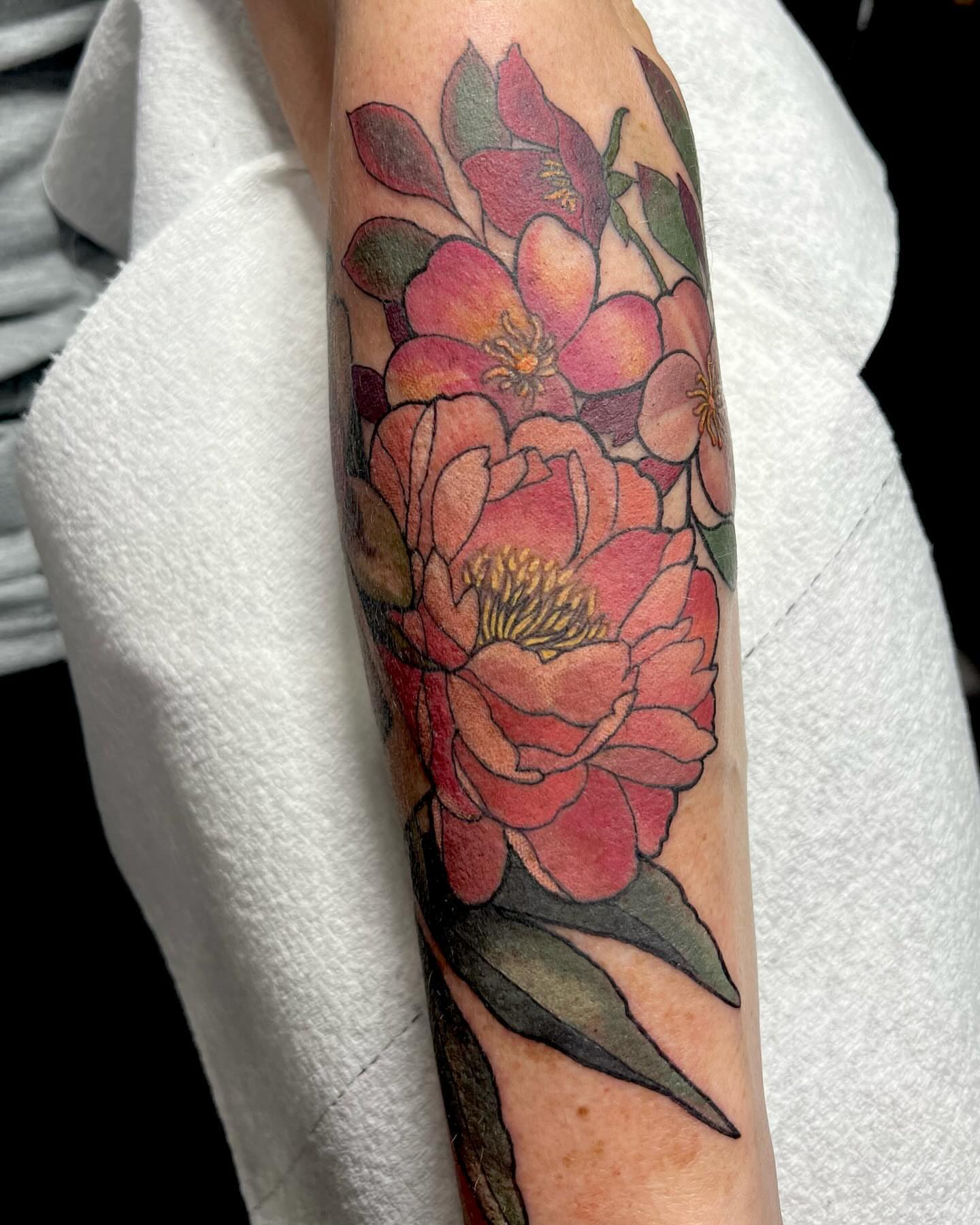 Peony flowers watercolor tattoo on the forearm by Tattoos by Alli Wilcox