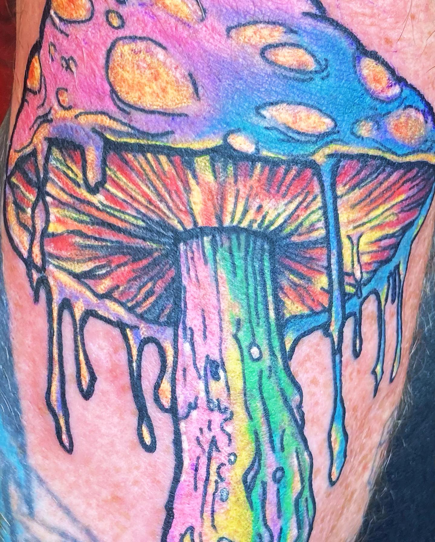 Psychedelic mushroom new school tattoo on the forearm by Markeith “Black Jesus” Heard