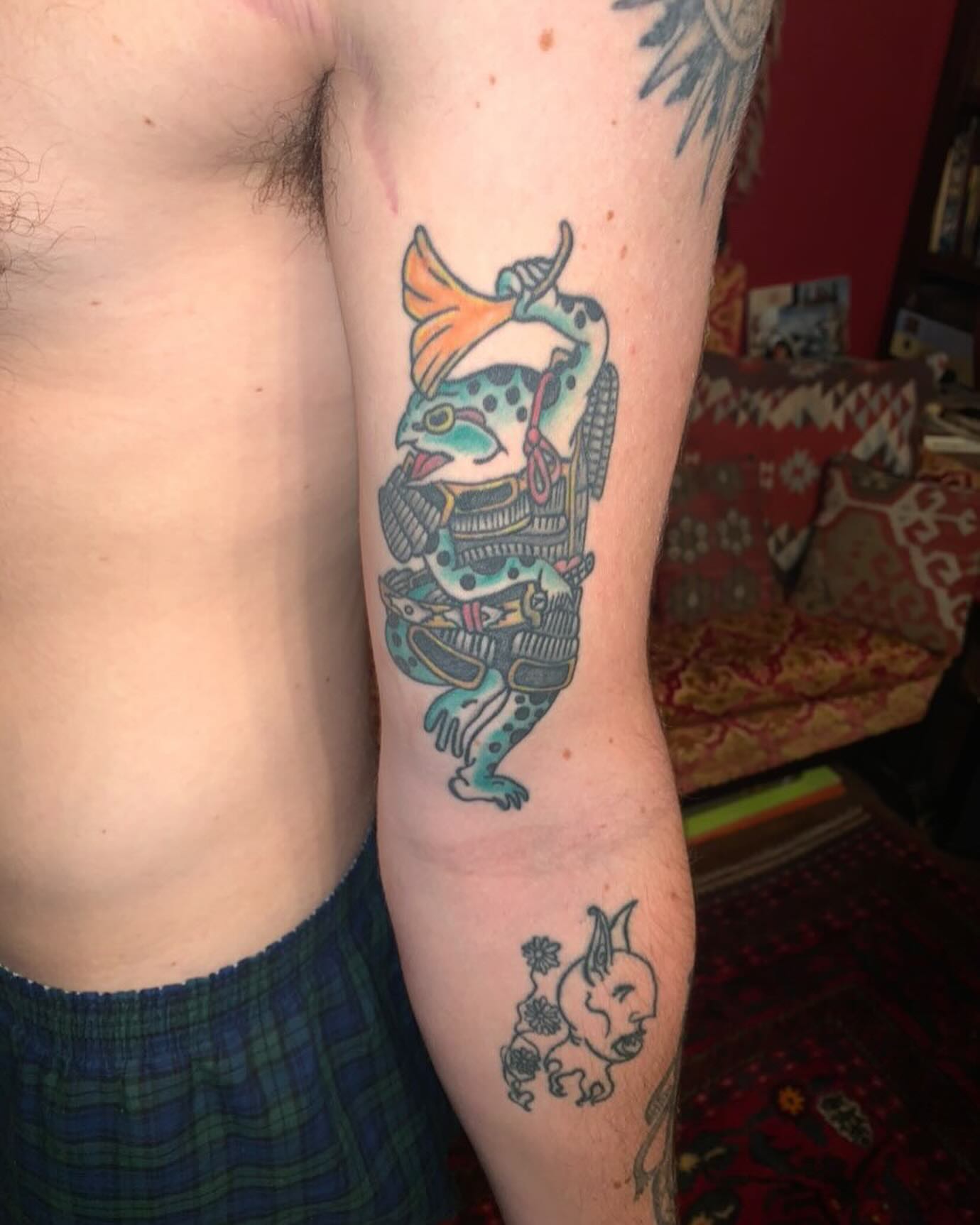 Fish samurai American traditional tattoo on the forearm by Barro