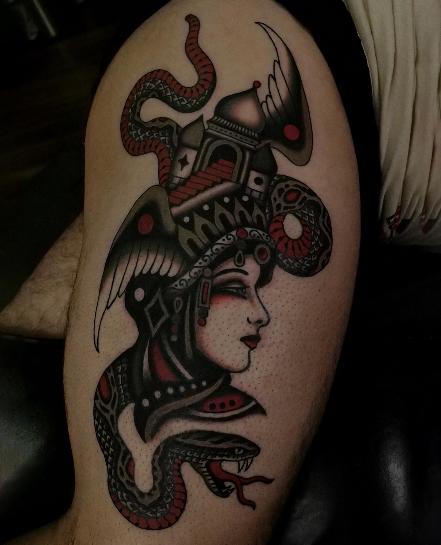 Woman with snake headdress American traditional tattoo on the thigh by Brandon Murphy