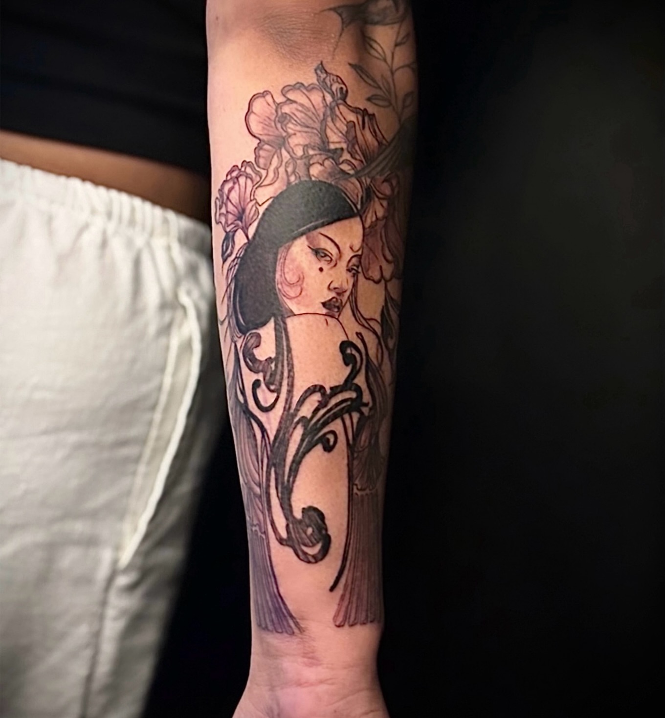 Woman with floral headdress neo-traditional tattoo on the forearm by Tattoos by Marcy