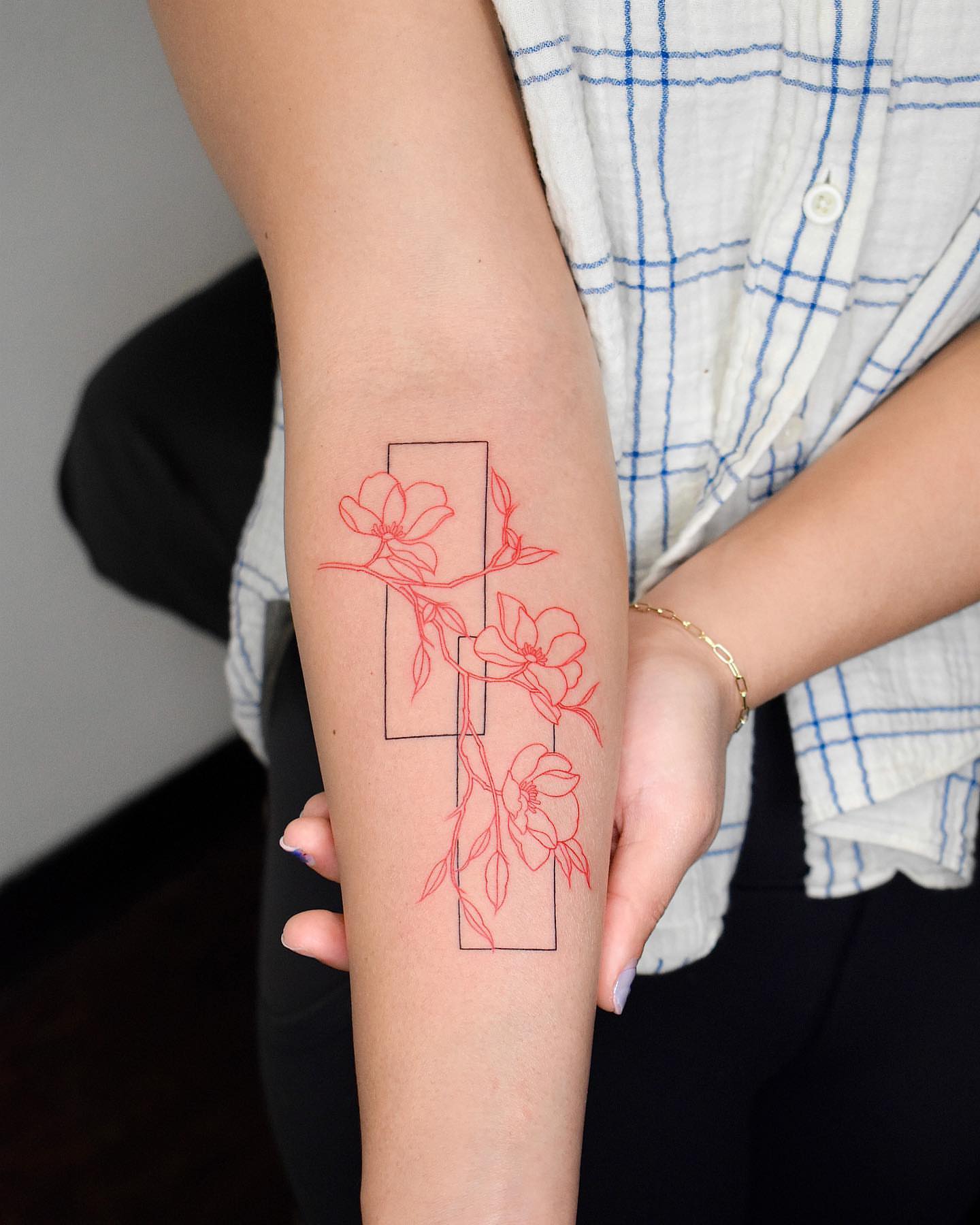 Flowers and branches fine line tattoo on the forearm by ๐๐๐ฆ ๐๐ ๐ฎ๐ฒ๐๐ง