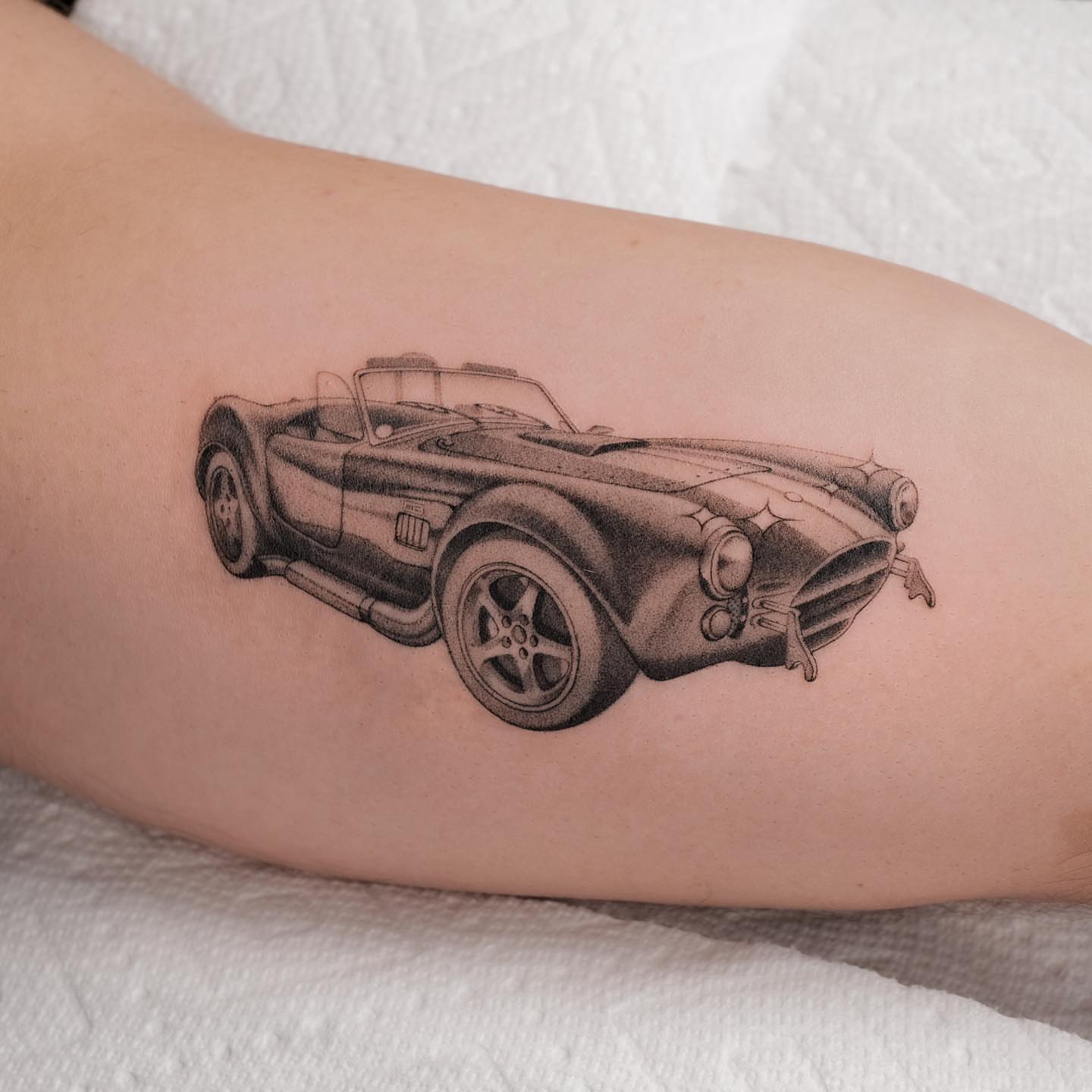 Sports car black and grey tattoo on the forearm by Jason Lu ✪