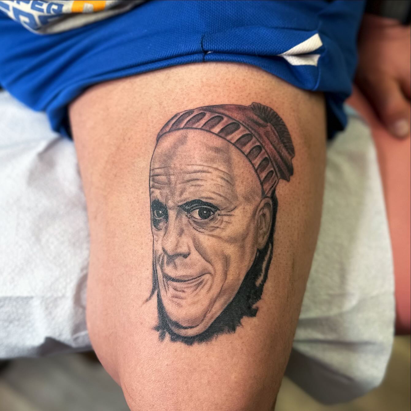 Portrait realism tattoo on the thigh by Diana Kunz