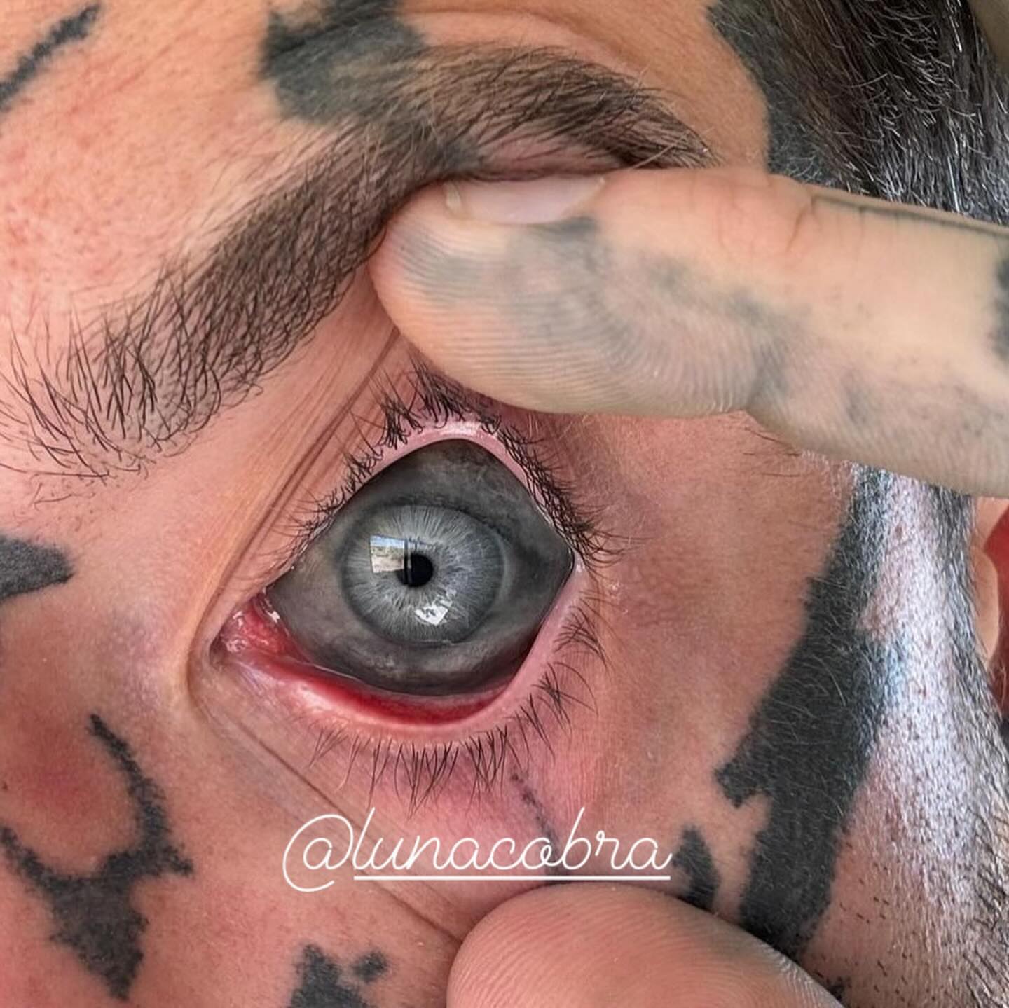 Eye realism tattoo on the head by lunacobra
