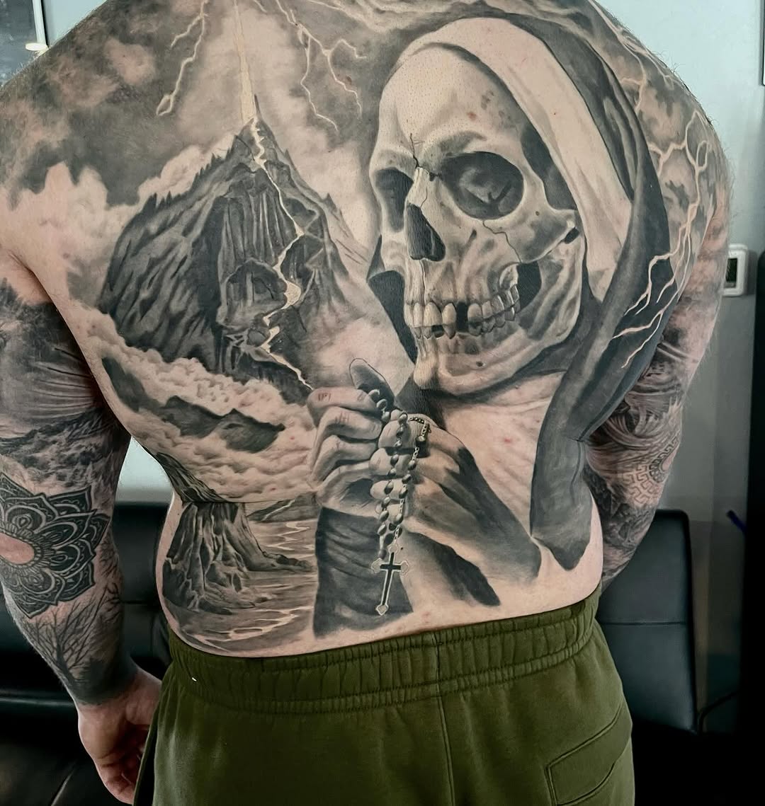 Realism tattoo on the back by Antonio Massimino