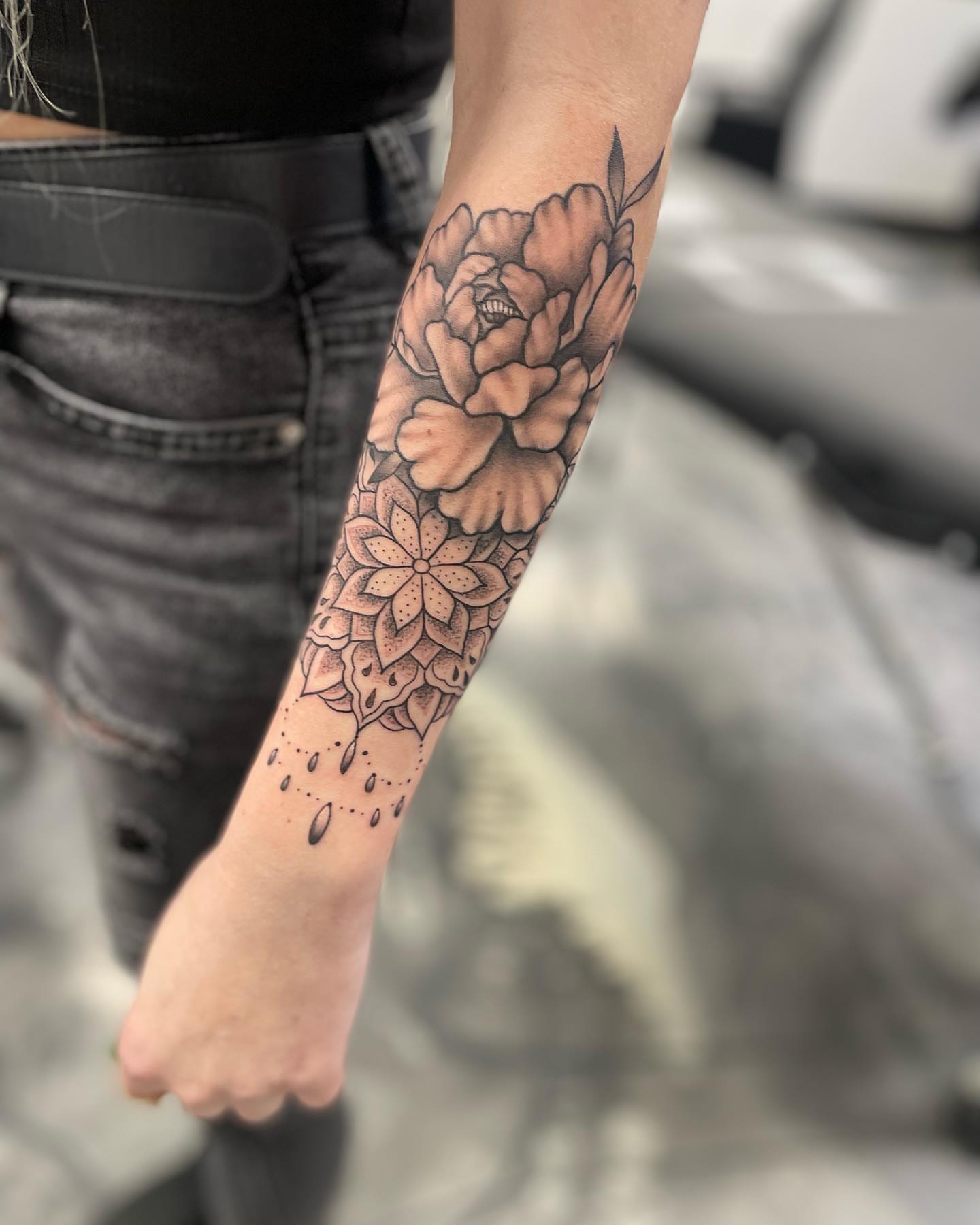 Floral mandala dotwork tattoo on the forearm by Brandon Anderson