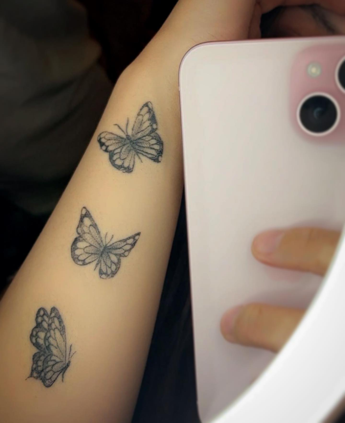 Butterfly black and grey tattoo on the forearm by Bear
