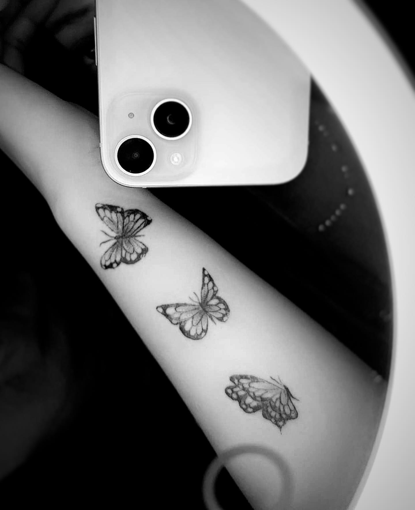 Butterflies black and grey tattoo on the forearm by Bear
