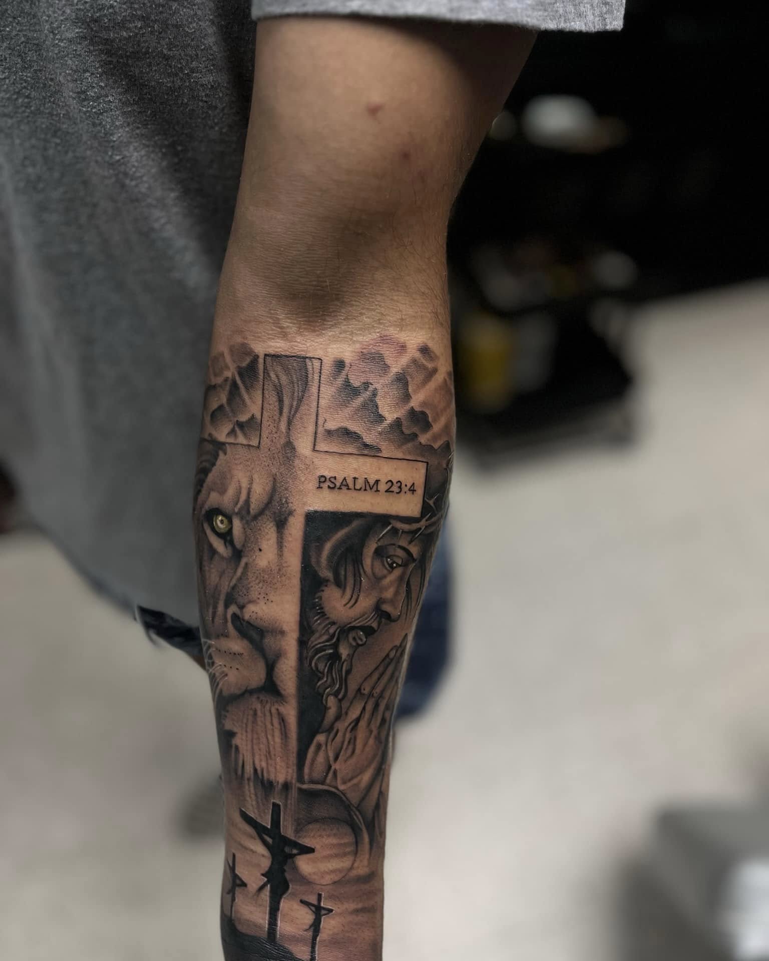 Lion and cross realism tattoo on the forearm by Chris_Tatt2_D’Ascenzo