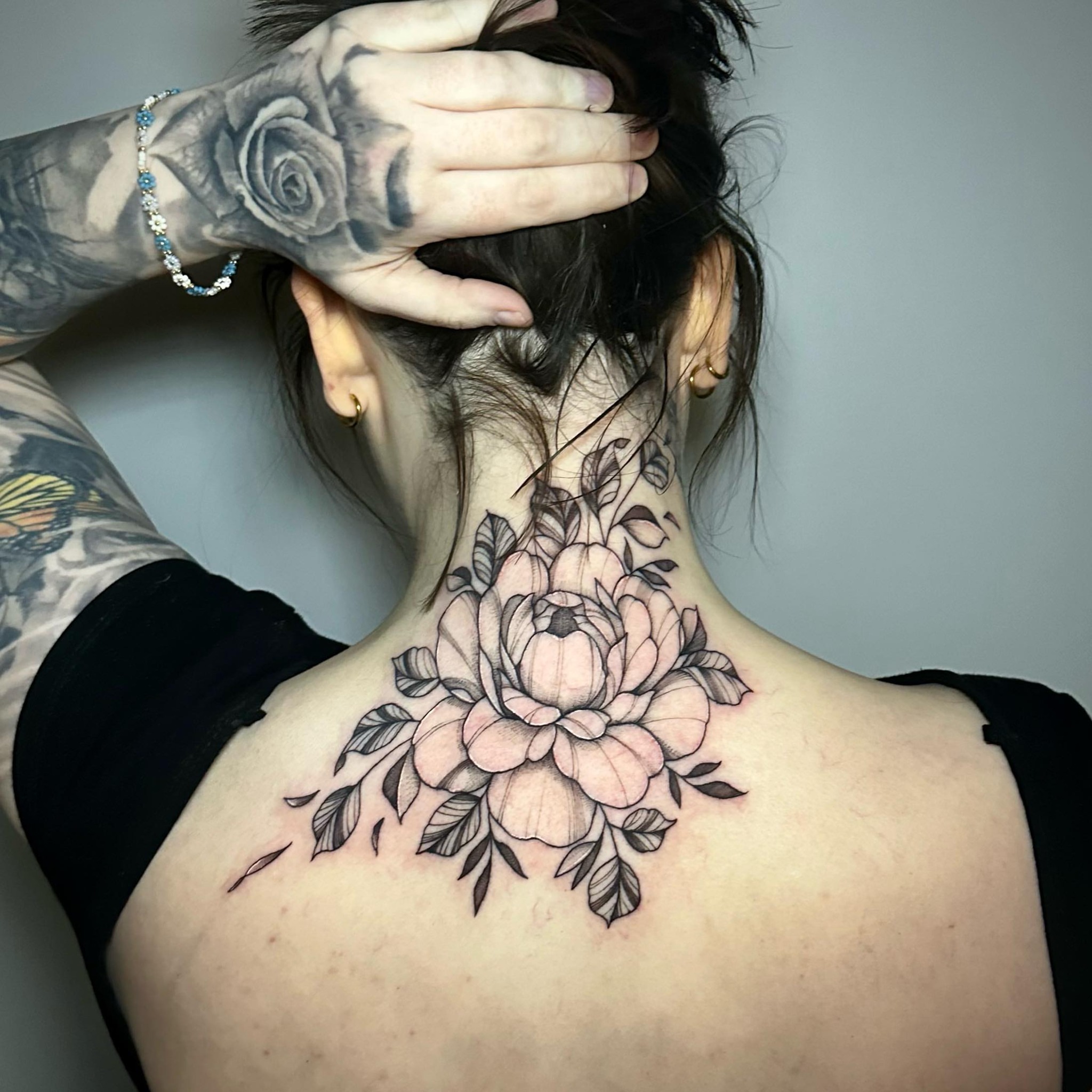 Peony black and grey tattoo on the neck by Megan McKee Tattoo Artist