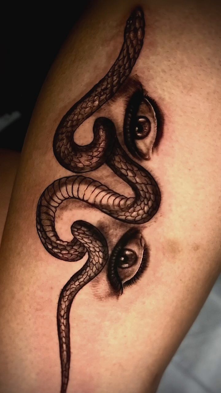 Snake with eyes realism tattoo by David Mariscal