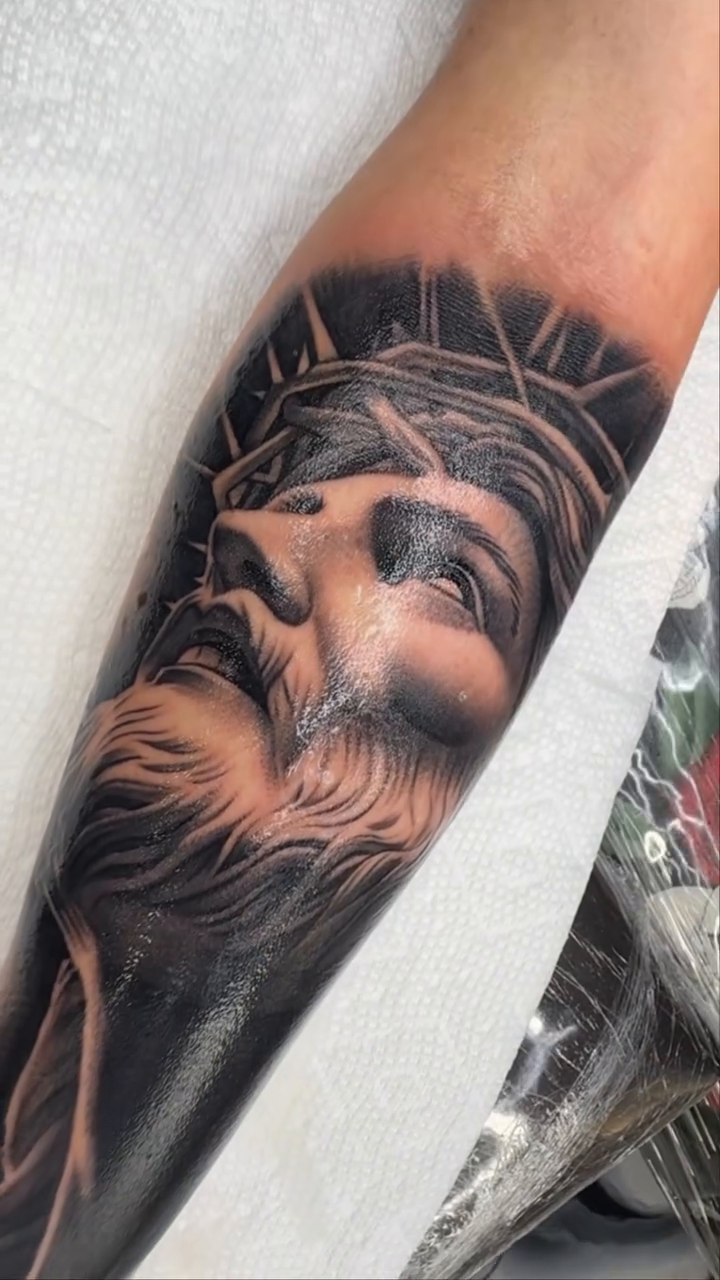 Jesus Christ portrait realism tattoo by Joseph Alvarado