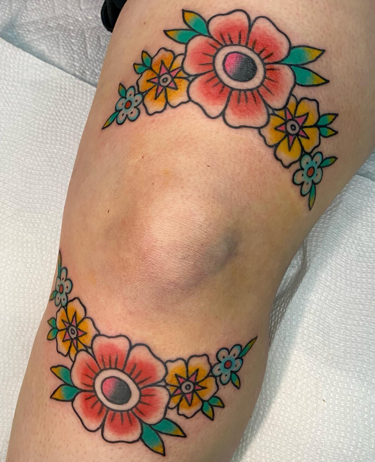 Floral bouquet American traditional tattoo on the thigh by Shana
