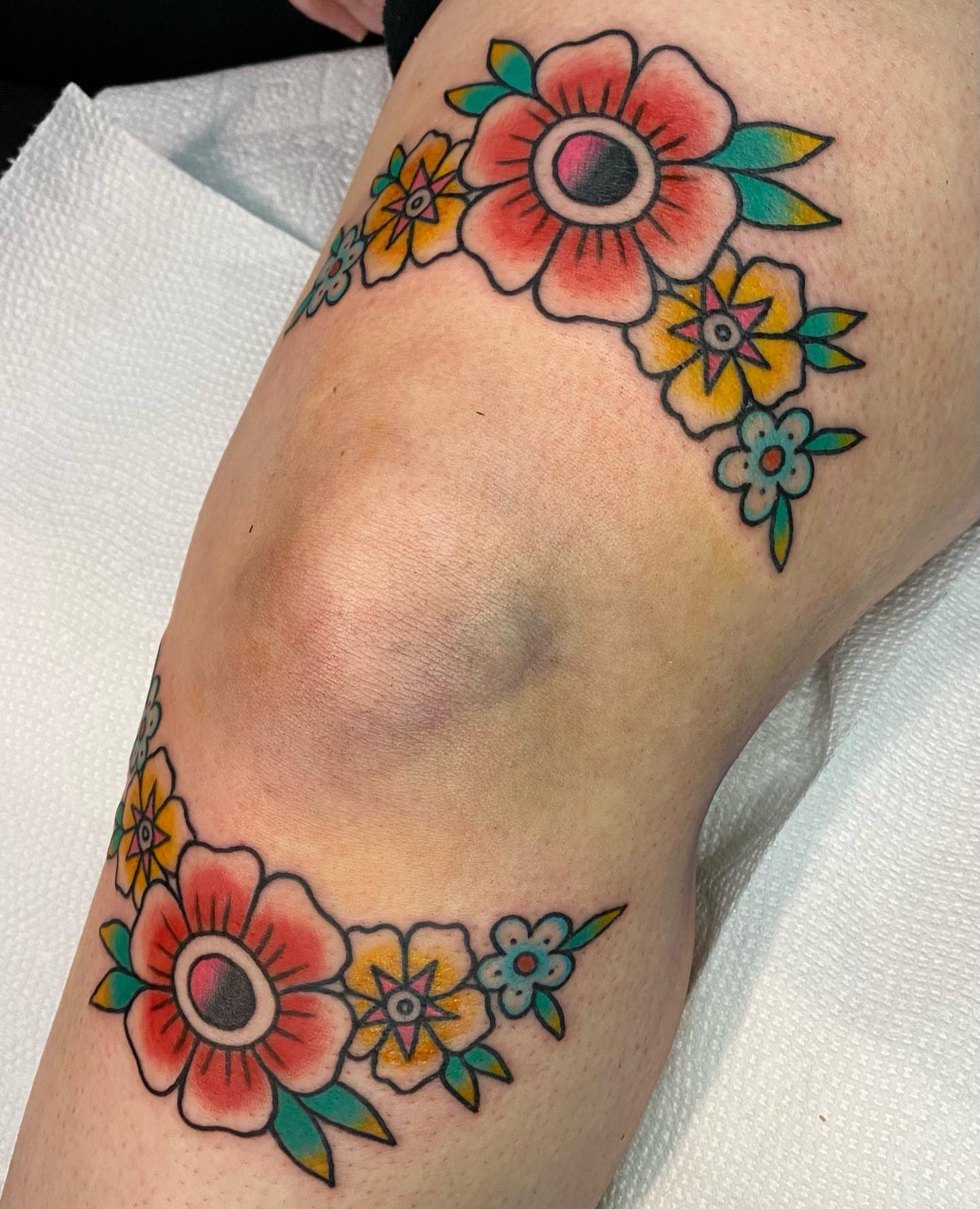 Floral bouquet American traditional tattoo on the forearm by Shana
