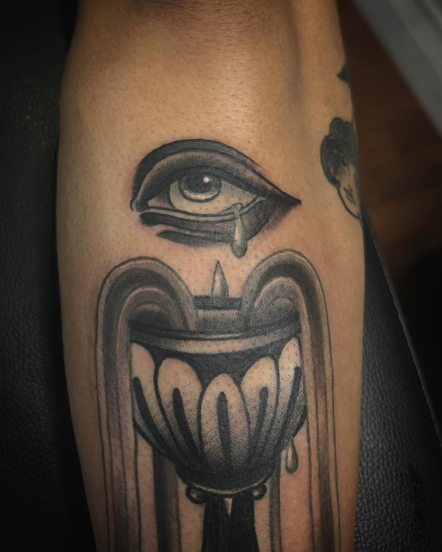 Eye and candle black and grey tattoo on the forearm by Samantha C, Bremerton, Washington